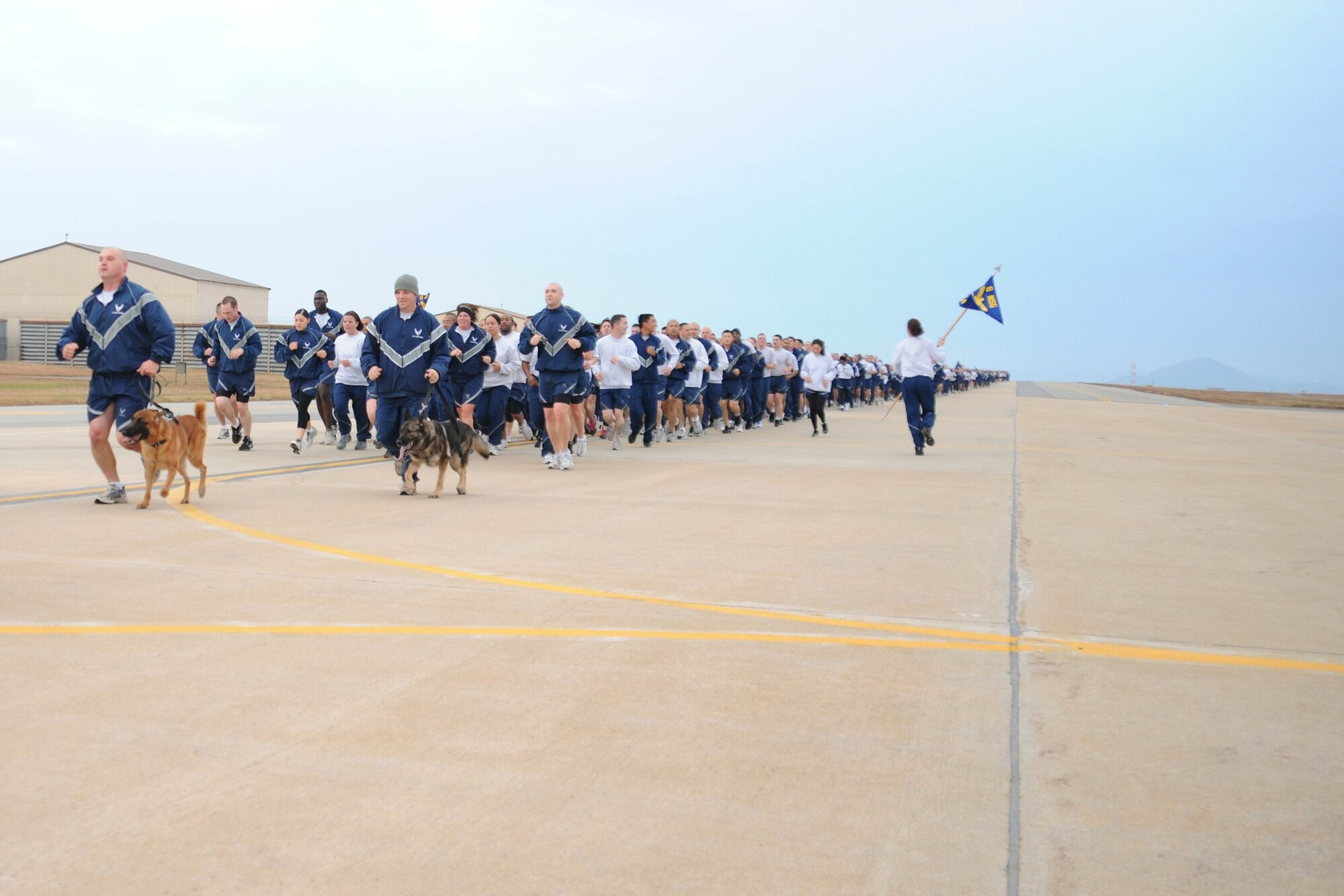 Members of the Wolf Pack participate in a warrior run at Kunsan Air Base, Republic of Korea, Nov. 10. The warrior run is a formation run and a way to boost the morale of Airmen and Soldiers. (U.S. Air Force photo by Senior Airman Brittany Y. Auld/Released)