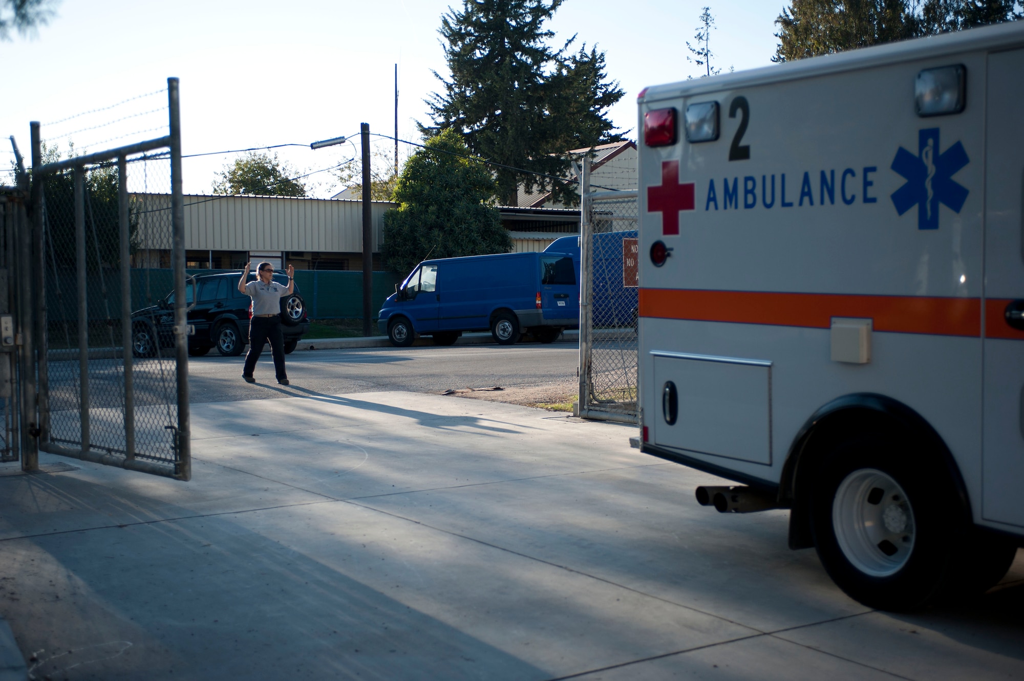 Staff Sgt. Tracy Metcalf, 39th Medical Group ambulance services medical technician, guides an ambulance as it is backed out of a fenced area Nov. 9, 2011, at Incirlik Air Base, Turkey. Ambulance services technicians respond to medical emergencies and care for patients while transporting them to a hospital off base. (U.S. Air Force photo by Senior Airman Clayton Lenhardt/Released)
