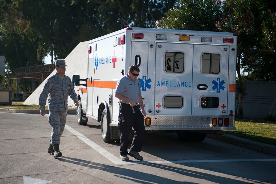 Staff Sgt. Manuel Mantalvo, left, and Tech. Sgt. Sergio Norat, both 39th Medical Group ambulance services medical technicians, leave to update ambulance radios Nov. 9, 2011, at Incirlik Air Base, Turkey. Ambulance services technicians maintain their vehicles as part of their daily duties. (U.S. Air Force photo by Senior Airman Clayton Lenhardt/Released)