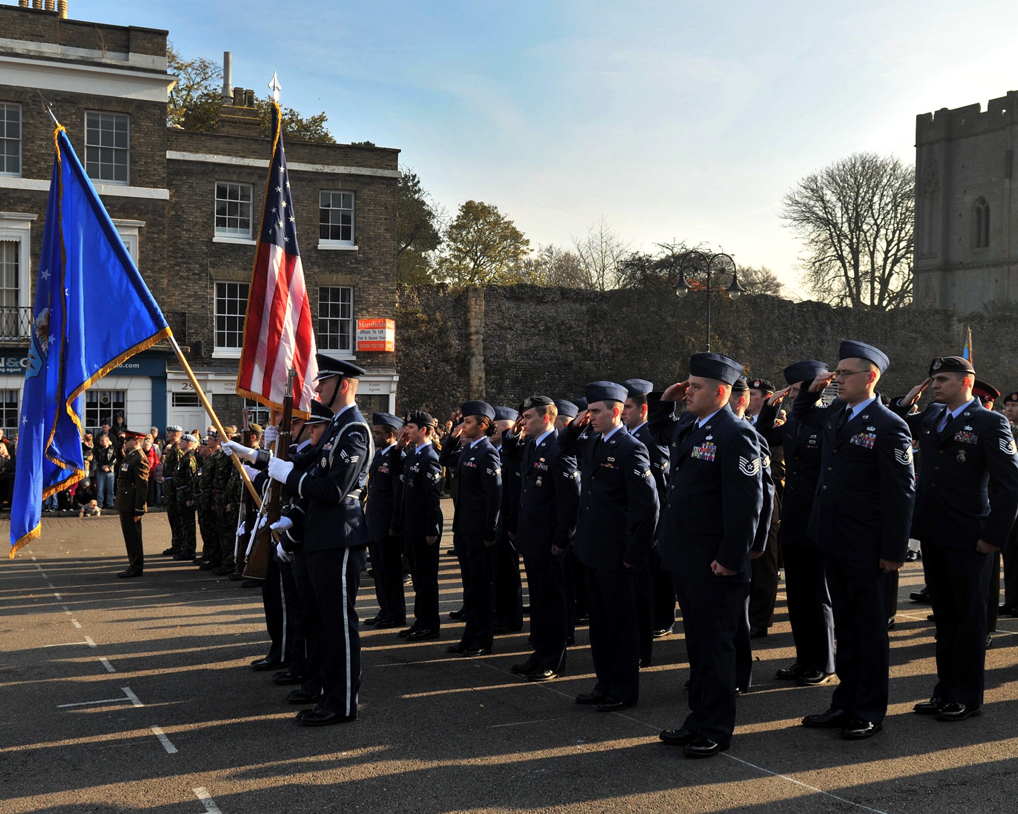 BURY ST. EDMUNDS, England – Airmen from RAFs Lakenheath and Mildenhall render salutes during the playing of the national anthem at the Angel Hill War Memorial in Bury St. Edmunds Nov. 13, 2011. Remembrance Day is observed throughout the U.K. commemorating the official end of World War I. (U.S. Air Force photo/Senior Airman Jerilyn Quintanilla)