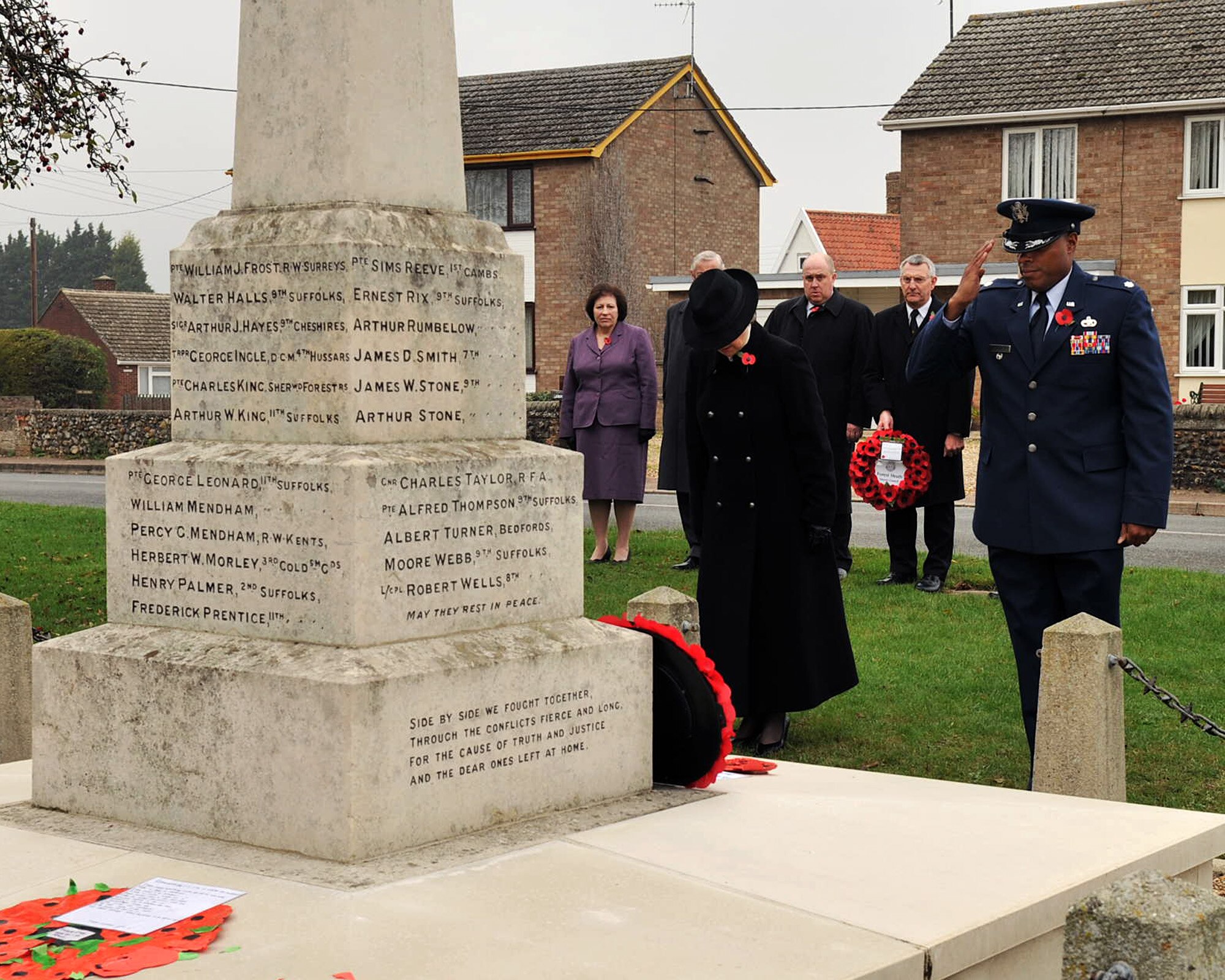 WEST ROW, England – Lt. Col. Will Phillips, 100th Mission Support Group deputy commander, right, and Caroline Steggles, CEO Mildenhall Parish Council, pay their respects at the war memorial in West Row Nov. 12, 2011. Airmen from RAFs Mildenhall, Lakenheath and Feltwell joined their British hosts celebrating and honoring those who made the ultimate sacrifice during World War I. (U.S. Air Force photo/Senior Airman Jerilyn Quintanilla)