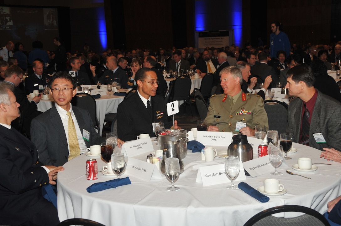 OMAHA, Neb. - Vice Adm. Cecil Haney, deputy commander, U.S. Strategic Command, has a discussion with international attendees during the 2011 USSTRATCOM Cyber and Space Symposium held Nov. 14-17 at the CenturyLink Center in downtown Omaha.