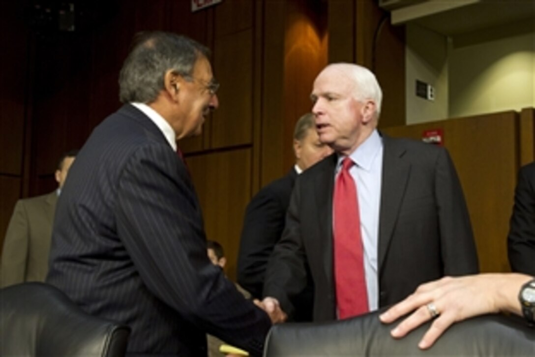 Defense Secretary Leon E. Panetta greets Sen. John McCain of Arizona, prior to testifying about the changing U.S. role in Iraq  before Senate Armed Services Committee, Nov. 15, 2011. 