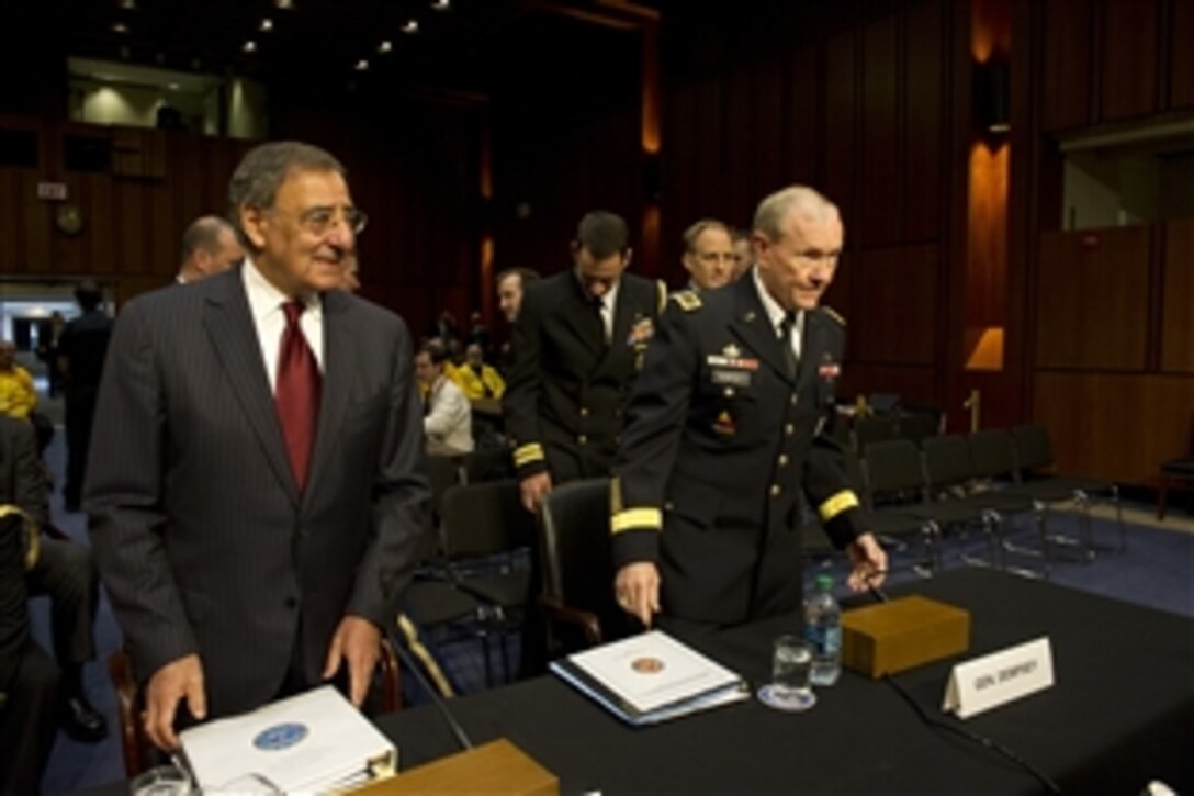 Defense Secretary Leon E. Panetta and and Army Gen. Martin E. Dempsey, chairman of the Joint Chiefs of Staff, arrive at the Hart Senate Building before testifying before the Senate Armed Services Committee, Nov.15, 2011.