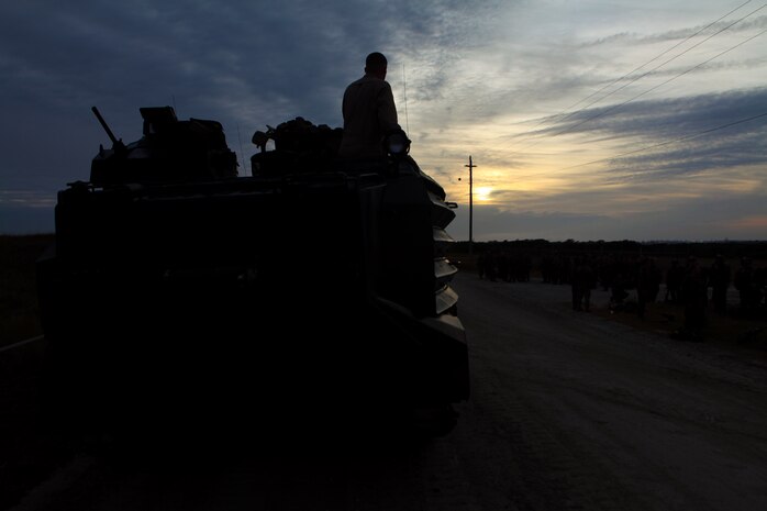 Marines with Alpha Company, 1st Battalion, 2nd Marine Regiment, in Assault Amphibious Vehicles, return from conducting a simulated raid during the Mechanized Raid Course, at Landing Zone Hawk, Nov. 15. The Mechanized Raid Course took place Nov. 7-18 to prepare the Marines and Sailors of Alpha Co. and the Assault Amphibian Vehicle (AAV) Platoon for their upcoming deployment as part of the 24th Marine Expeditionary Unit's Battalion Landing Team.