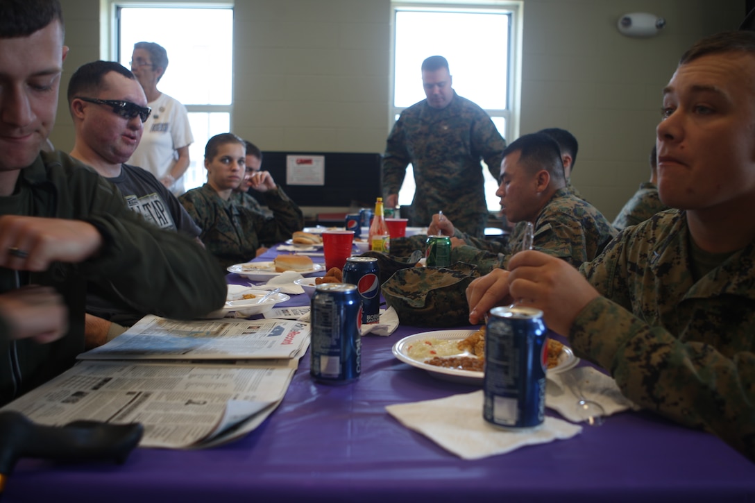 Marines with Wounded Warrior Battalion – East enjoy a lunch provided by Purple Heart Homes, a non-profit organization dedicated to aiding service-connected wounded veterans, during their appreciation luncheon at the WWBn-E barracks aboard Marine Corps Base Camp Lejeune, Nov. 16. (Official U.S. Marine Corps photo by Cpl. Jonathan G. Wright)