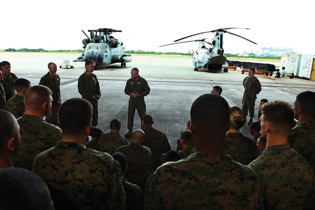 Lt. Gen. Kenneth J. Glueck Jr., III Marine Expeditionary Force commanding general, speaks to the Marines of Marine Medium Helicopter Squadron 265 (REIN) after presenting the squadron with the Marine Corps Achievement in Safety Award Nov. 16. The squadron is part of the 31st Marine Expeditionary Unit.::r::::n::::r::::n::