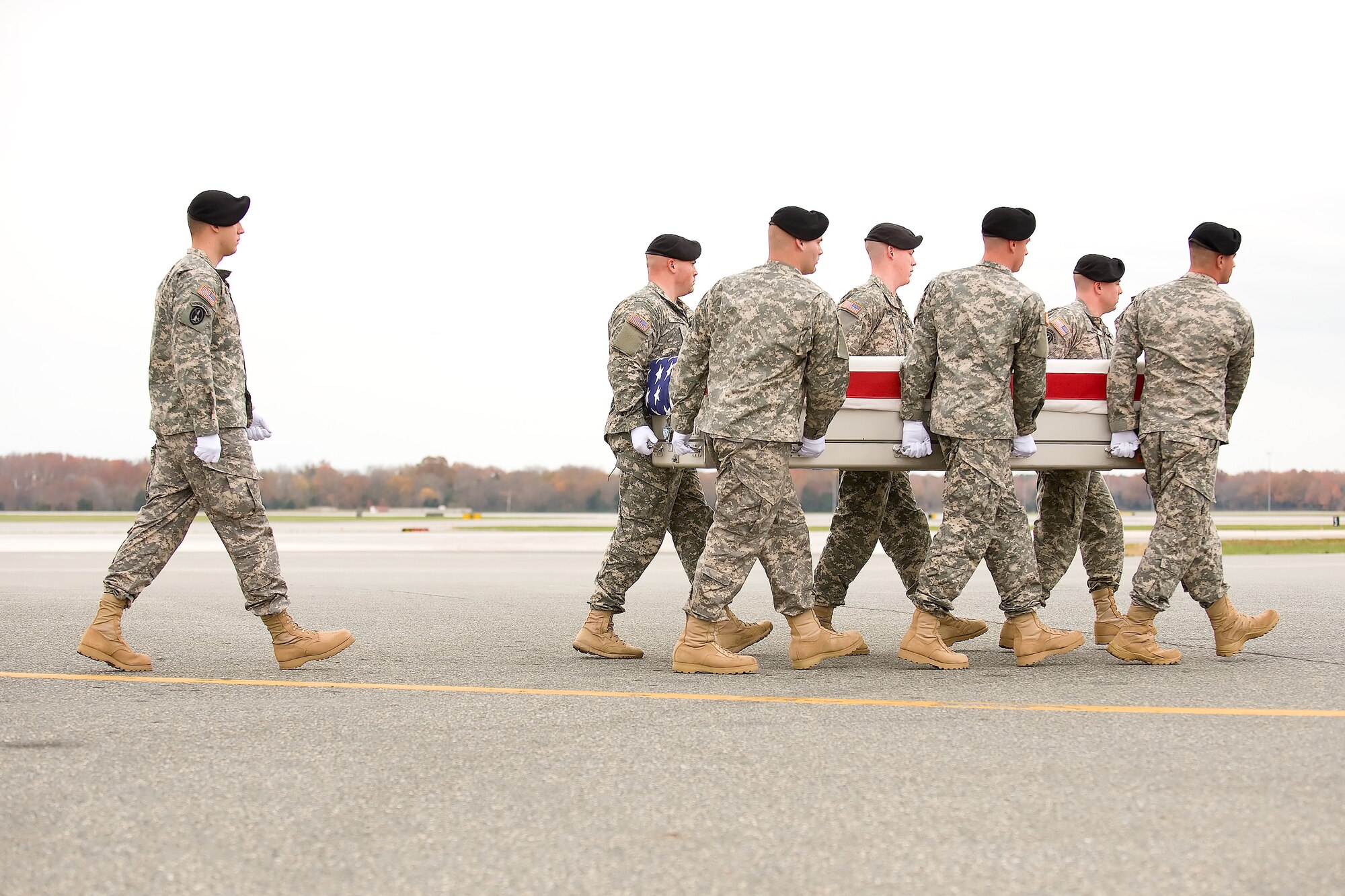 A U.S. Army carry team transfers the remains of Army Sgt. 1st Class Johnathan B. McCain of Apache Junction, Ariz., at Dover Air Force Base, Del., Nov. 15, 2011. McCain was assigned to the 1st Battalion, 5th Infantry Regiment, 1st Stryker Brigade Combat Team, 25th Infantry Division, Fort Wainwright, Alaska. (U.S. Air Force photo/Adrian R. Rowan)
