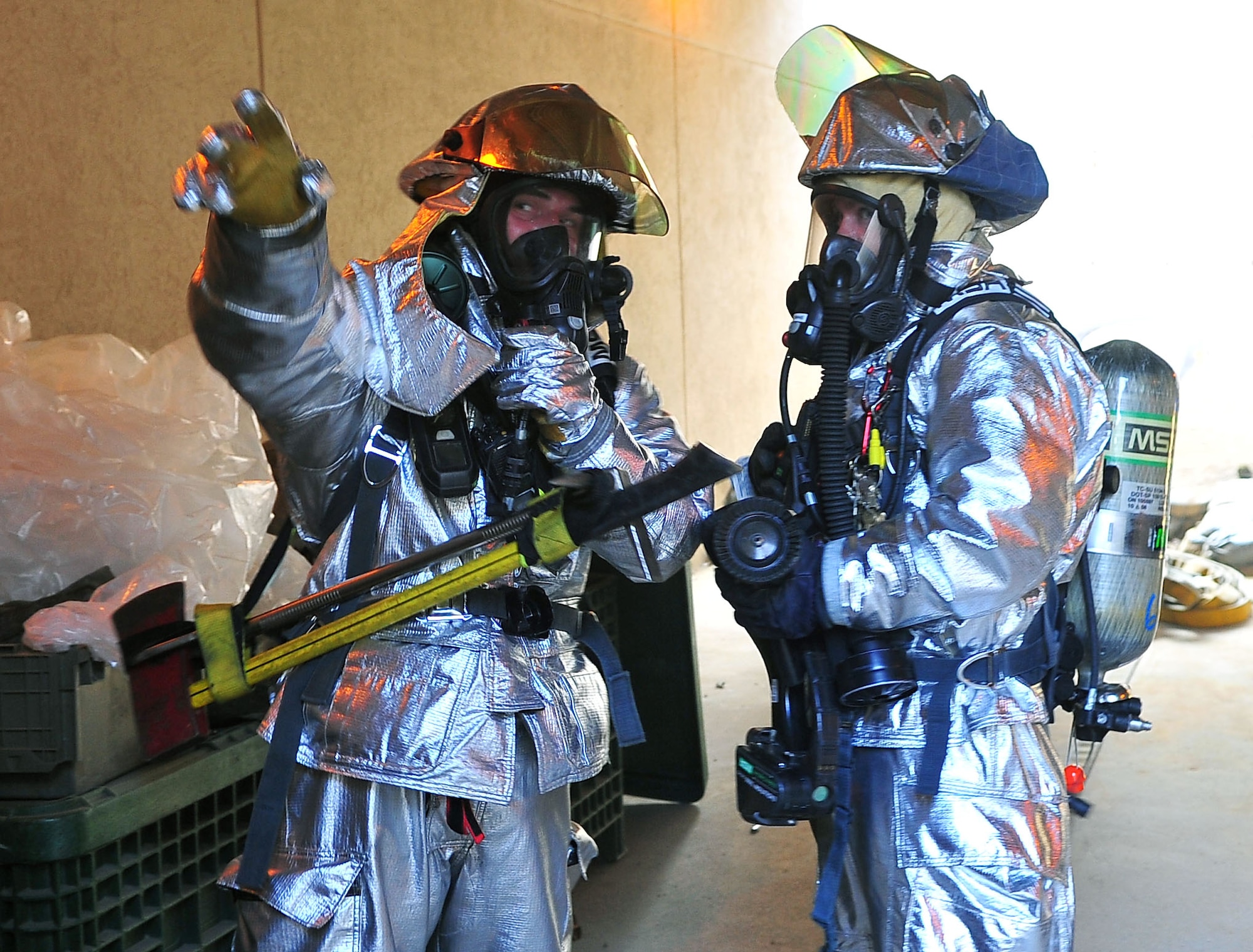 Firefighters evacuate communication building during fire call Firefighters from the 51st Civil Engineering Squadron respond to a building fire and evacuatione exercise part of the Beverly Bulldog 11-03 pennisula-wide exercise Nov. 16, 2011. (U.S Air Force photos/ Daylena Gonzalez)