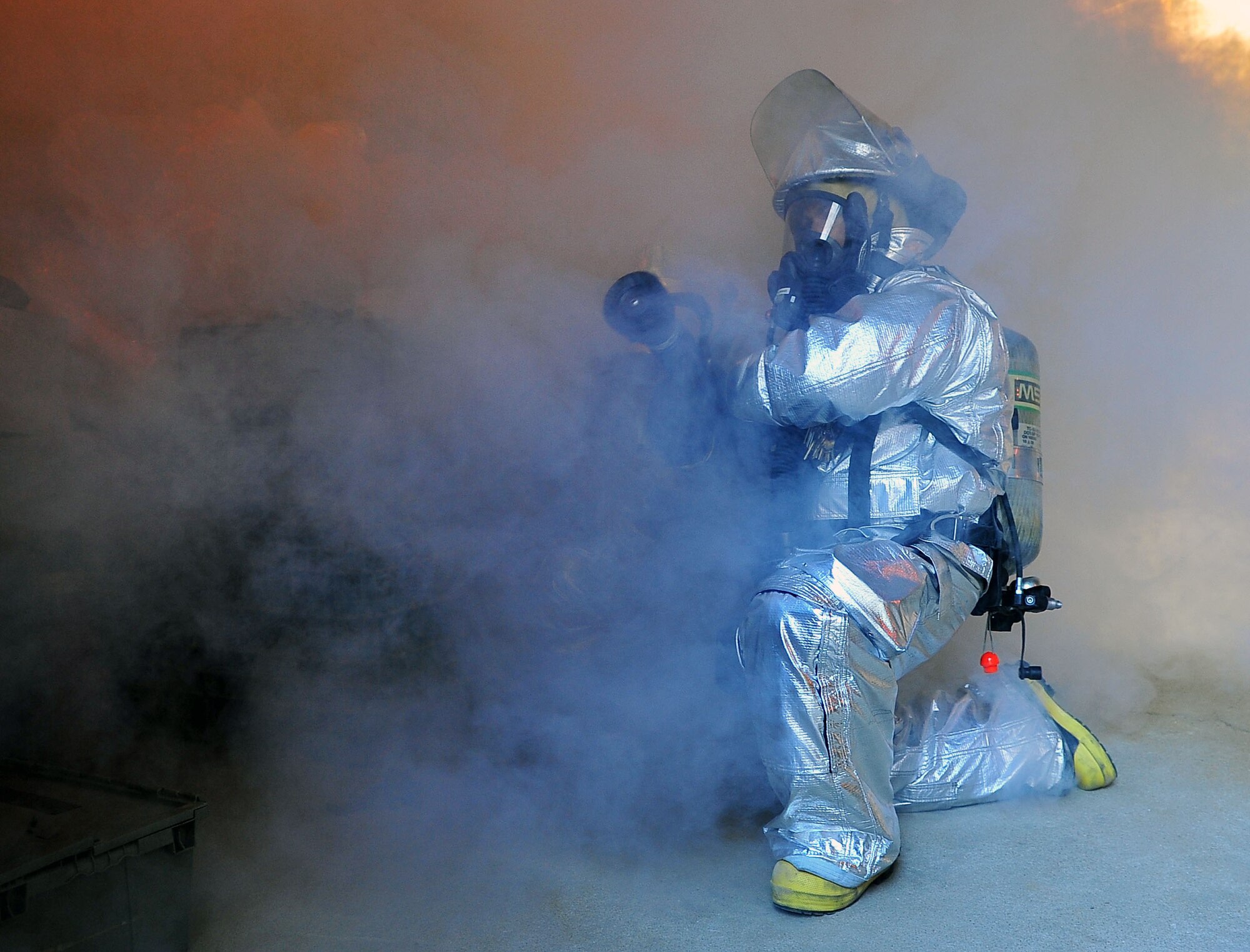 Firefighters evacuate communication building during fire call Firefighters from the 51st Civil Engineering Squadron respond to a building fire and evacuatione exercise part of the Beverly Bulldog 11-03 pennisula-wide exercise Nov. 16, 2011. (U.S Air Force photos/ Daylena Gonzalez)