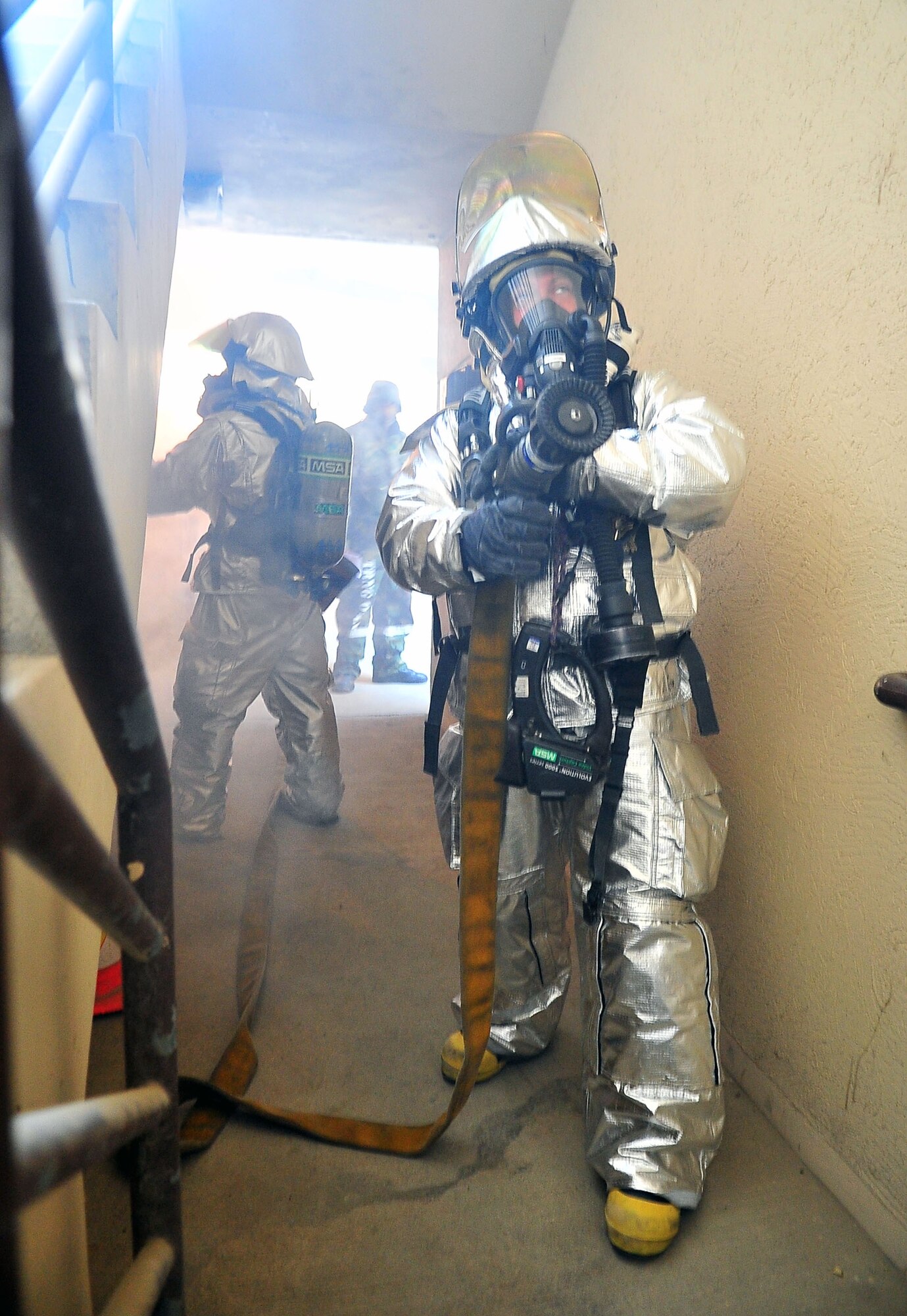 Firefighters evacuate communication building during fire call Firefighters from the 51st Civil Engineering Squadron respond to a building fire and evacuatione exercise part of the Beverly Bulldog 11-03 pennisula-wide exercise Nov. 16, 2011. (U.S Air Force photos/ Daylena Gonzalez)