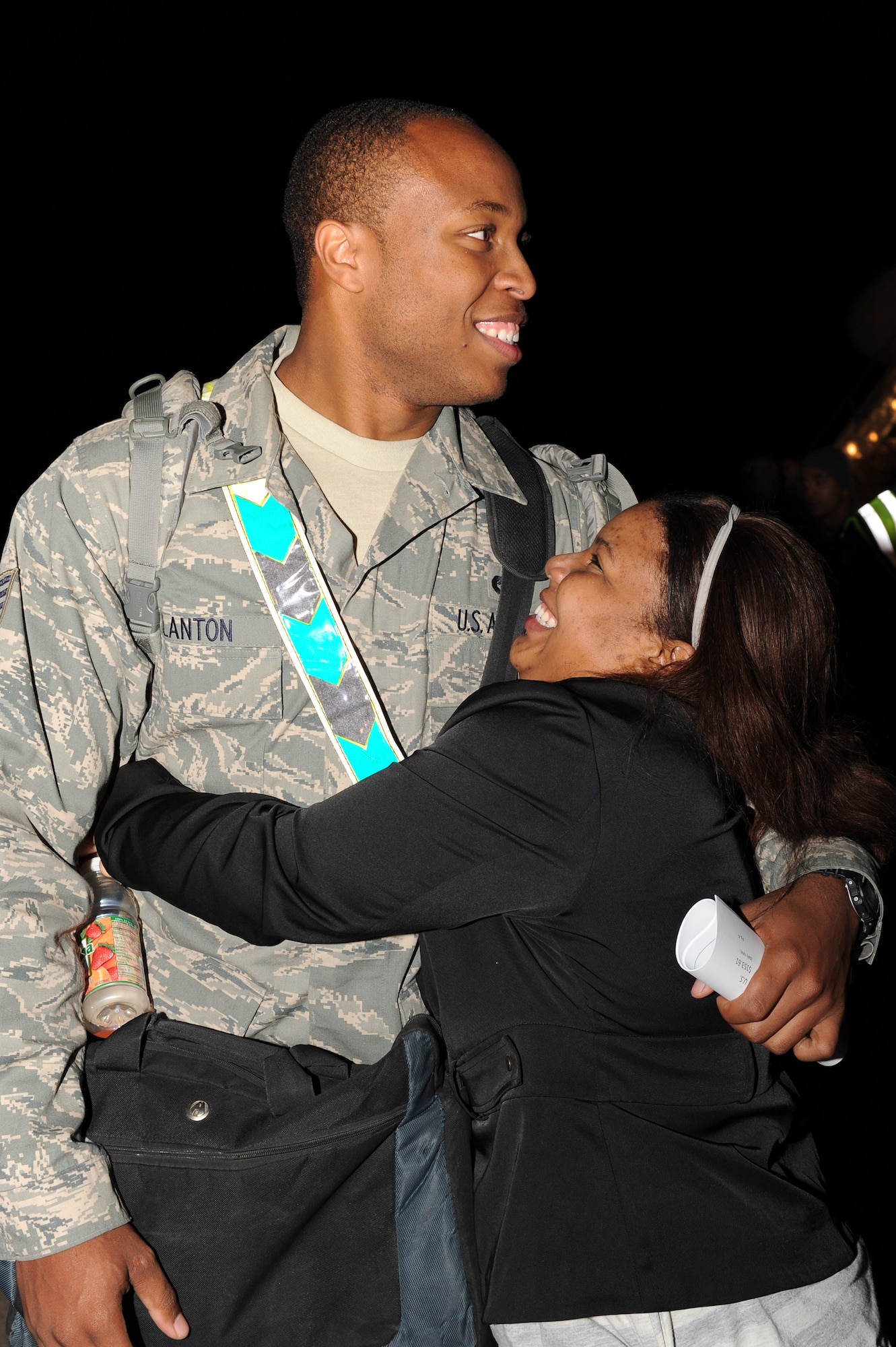 Staff Sgt. Jimmy Clanton, a 19th Component Maintenance Squadron fuel system repair craftsman, embraces his wife Shannon Wednseday, upon returning from a deployment supporting combat operations in Southwest Asia. Families and friends waited for hours in chilly temperatures to greet their loved ones, who spent more than six months deployed abroad. (U.S. Air Force photo by Tech. Sgt. Chad Chisholm)