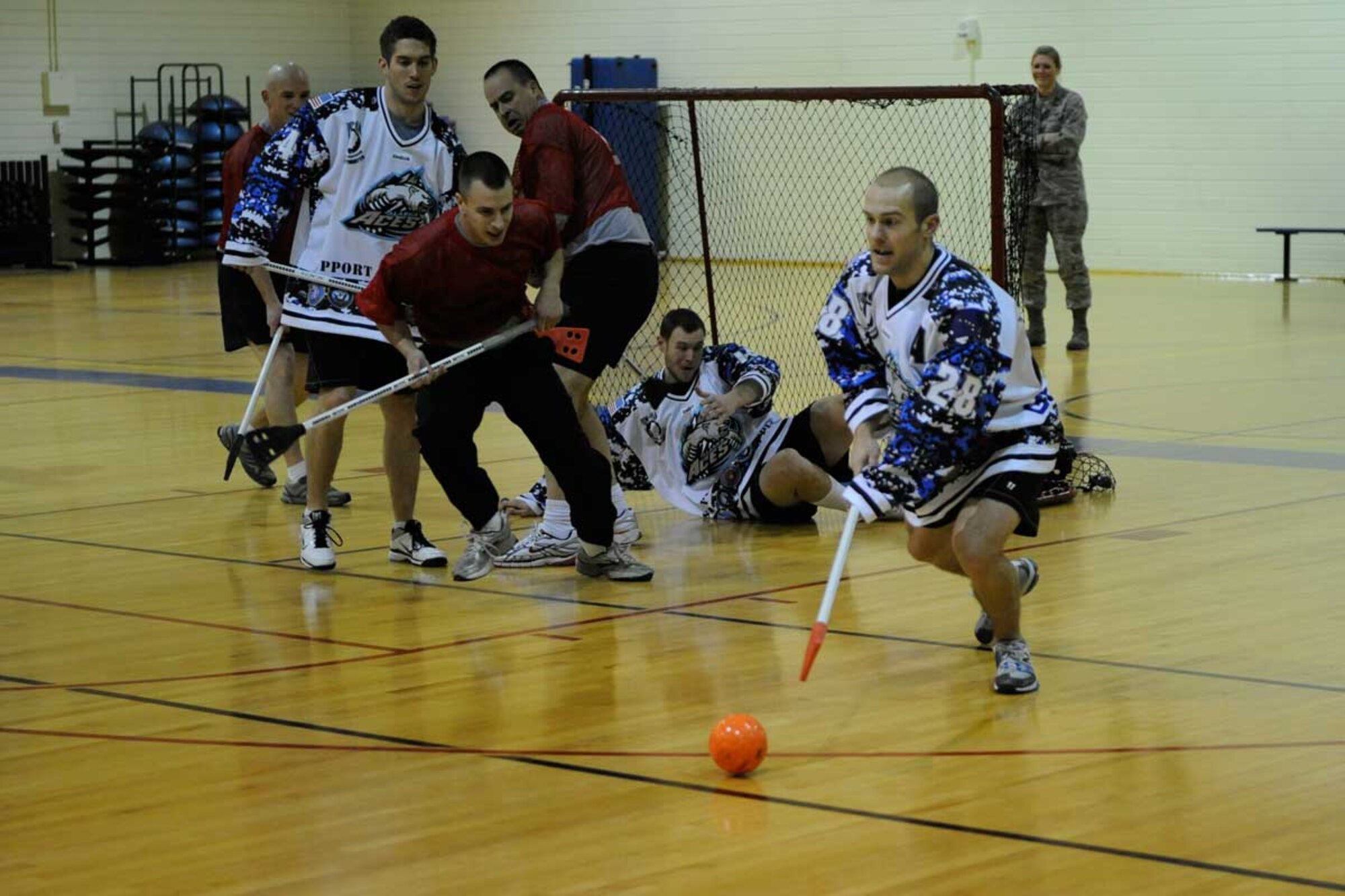 Soldiers and Airmen assigned to Joint Base Elmendorf-Richardson had a chance to play broomball against Anchorage’s ECHL professional hockey team, the Alaska Aces, during a game held at the Elmendorf fi tness center Nov. 9. The Alaska Aces won the Kelly Cup in 2010 as champions of the 19-team ECHL. They handed out free tickets to games for their military appreciation weekend at the conclusion of the game. (U.S. Air Force photo/Steve White)