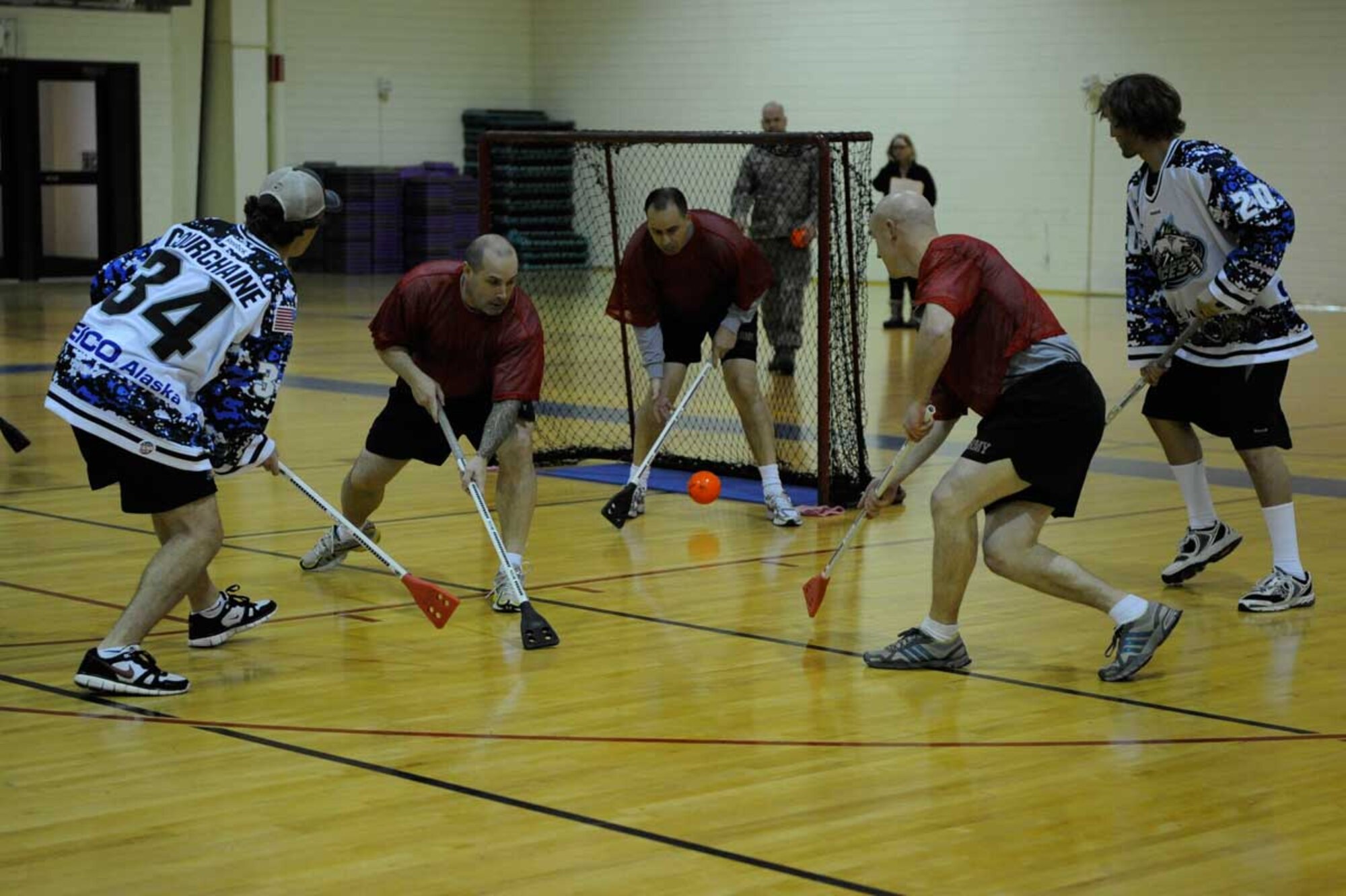 Soldiers and Airmen assigned to Joint Base Elmendorf-Richardson had a chance to play broomball against Anchorage’s ECHL professional hockey team, the Alaska Aces, during a game held at the Elmendorf fi tness center Nov. 9. The Alaska Aces won the Kelly Cup in 2010 as champions of the 19-team ECHL. They handed out free tickets to games for their military appreciation weekend at the conclusion of the game. (U.S. Air Force photo/Steve White)