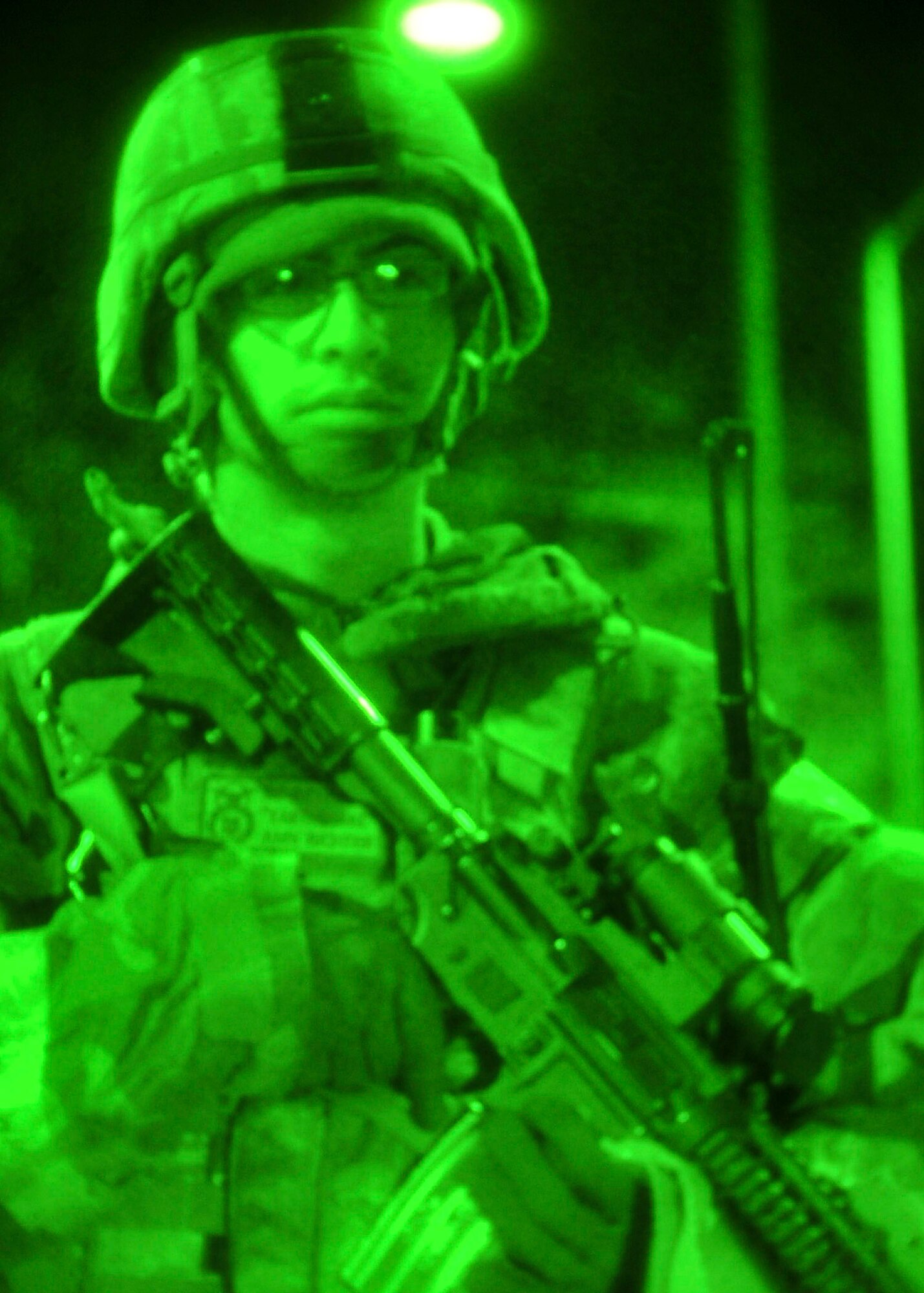 Airman 1st Class Tristian Richter, 51st Security Forces Squadron entry controller, stands guard at the top of hill 180 during Beverly Bulldog 11-03, a peninsula-wide operational readiness exercise Nov. 14, 2011. The Airmen are participating in a peninsula wide operational readiness exercise, Beverly Bulldog 11-03, held to train U.S. forces throughout South Korea. (U.S. Air Force photos/Senior Airman Adam Grant)