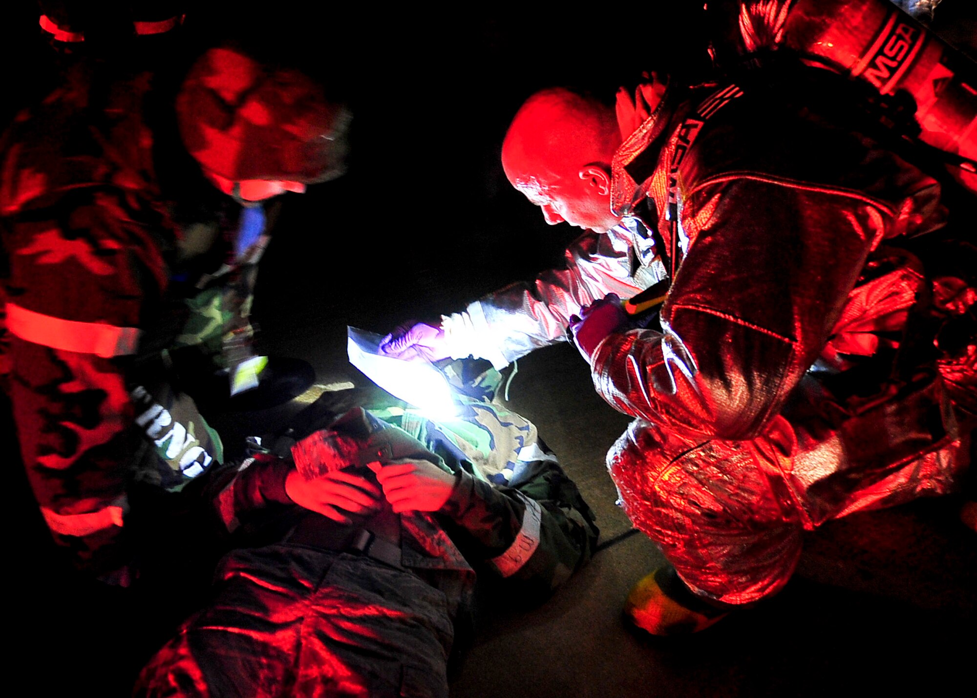 Airmen from both the 51st Aerospace Medicine Squadron and the 51st Civil Engineer Squadron work together to ensure the safety and well being of patients during  Beverly Bulldog 11-03, a peninsula-wide operational readiness exercise Nov. 14, 2011. This scenario tested the preparedness of Osan responders as well as their abilities to work together to accomplish the mission during Beverly Bulldog 11-03. (U.S. Air Force photos/Senior Airman Adam Grant)