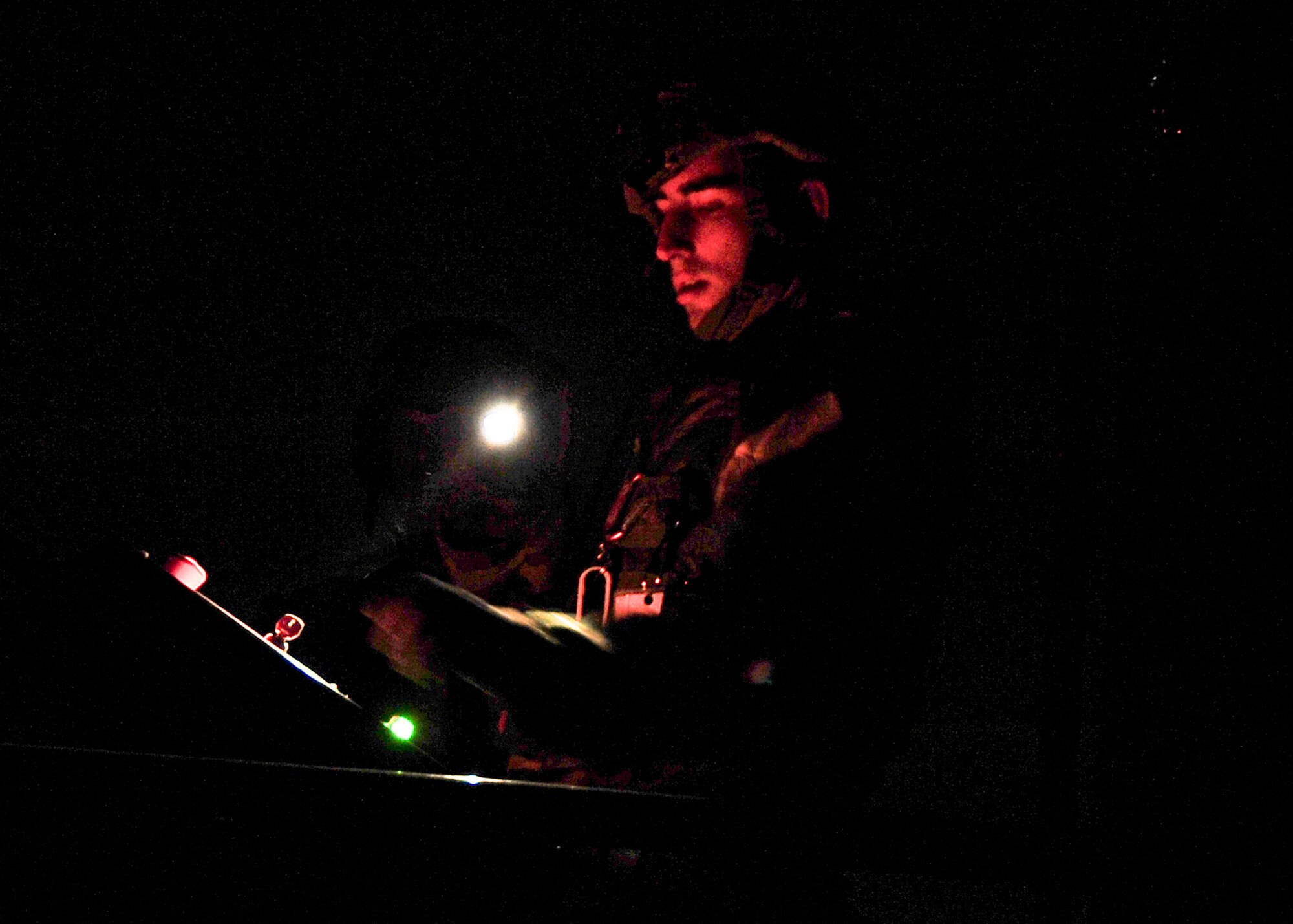Staff Sgt. Paul Morris, 51st Civil Engineer Squadron fire fighter, looks over a control panel before starting a simulated plane crash during  Beverly Bulldog 11-03, a peninsula-wide operational readiness exercise Nov. 14, 2011. Beverly Bulldog 11-03 scenarios test team Osan’s ability to defend the base and conduct daily operations in a combat environment. (U.S. Air Force photos/Senior Airman Adam Grant)