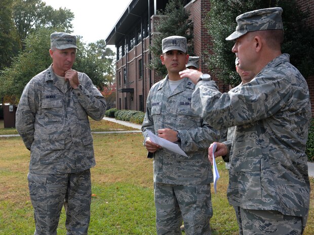 Col. Richard McComb, along with Capt. Jason Guadalupe brief Maj. Gen. William Bender on "Warrior Week" procedures for the upcoming Operational Readiness Inspection on Joint Base Charleston Nov.15. The ORI will take place Nov.29th through Dec.6th. McComb is the Commander of 628th Air Base Wing, Bender is the Commander of United States Air Force Expenditionary Center, Joint Base McGuire-Dix-Lakehurst, N.J., and Guadalupe is the Operations Officer for the 628th Force Support Squadron. (U.S. Air Force photo/Airman 1st Class Ashlee Galloway) 