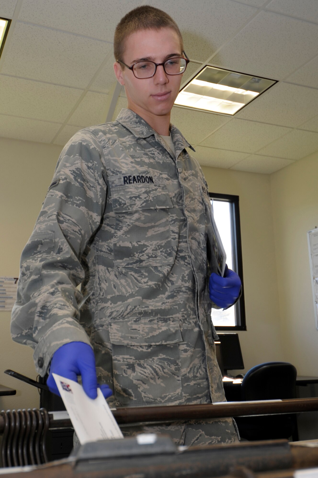 VANDENBERG AIR FORCE BASE, Calif. -- Airman Nicholas Reardon places a letter in a bulk mailbag here Wednesday, Nov. 16, 2011. The Official Mail Center is collocated with the Vandenberg Post Office at 100 Community Loop, Building 10373.
(U.S. Air Force photo/Jerry E. Clemens, Jr.)