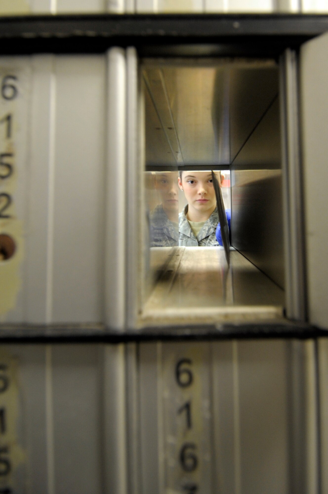 VANDENBERG AIR FORCE BASE, Calif. -- Airman 1st Class Taylor Lacey places a letter in a mailbox here Wednesday, Nov. 16, 2011. The Official Mail Center is collocated with the Vandenberg Post Office at 100 Community Loop, Building 10373.
 (U.S. Air Force photo/Jerry E. Clemens, Jr.)