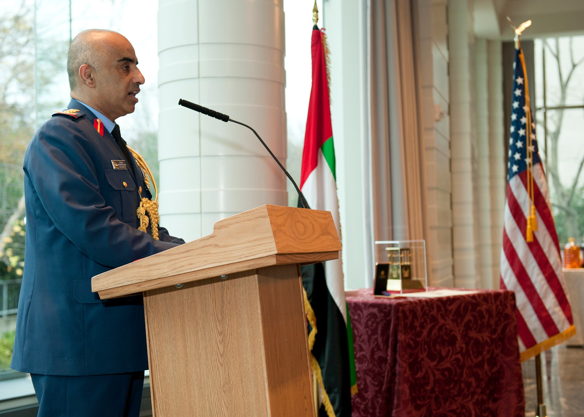 The United Emirates (UAE) Air Attaché Col. Abdelrahmn Al-Mazmiby gives opening remarks before presenting the Foreign Operations Missions Medal to Air Combat Command commander U.S. Air Force Gen. Mike Hostage III during a ceremony at the UAE Embassy, Washington D.C. on Nov. 15, 2011. (U.S. Air Force photo by Jim Varhegyi/Released)