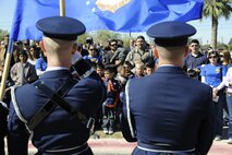 LAUGHLIN AIR FORCE BASE, Texas - A crowd of onlookers pay respect to the colors in a ceremony held at the Del Rio Civic Center in honor of Veteran's Day Nov. 11. The ceremony hosted several guest speakers, including civic leaders and veterans in honor of all who have served. (U.S. Air Force photo/Airman 1st Class Nathan L. Maysonet)   