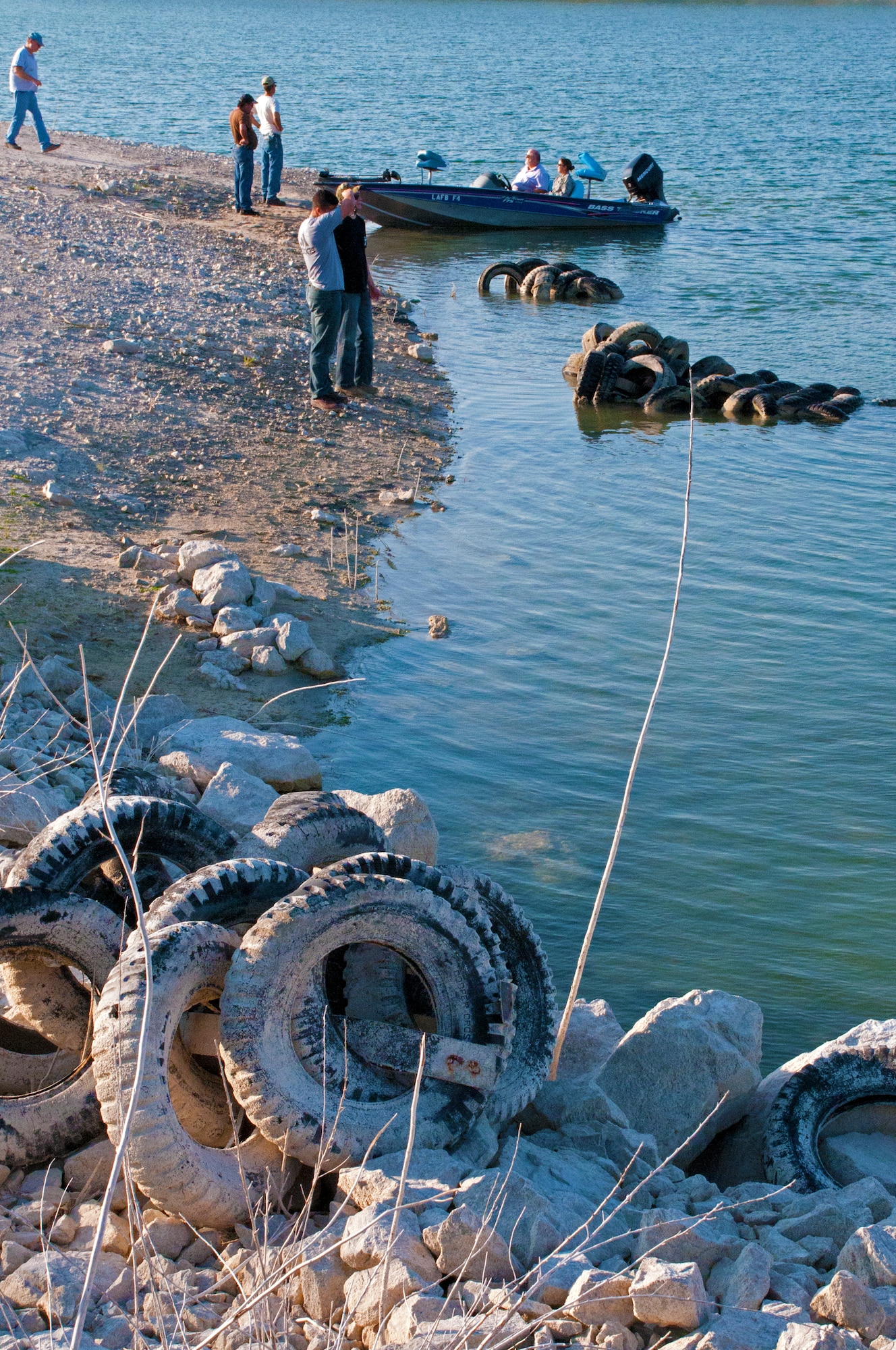 LAUGHLIN AIR FORCE BASE, Texas – Volunteers from multiple agencies came together to remove thousands of tires from Lake Amistad Sept. 2. The old WWII Jeep tires were installed in the marina decades ago by the Army Corps of Engineers to protect the marina from high winds. Powerful storms throughout the last 30 years damaged the structure and ultimately gave way in 2011, littering the shorelines. (U.S. Air Force photo/Senior Airman Scott Saldukas)