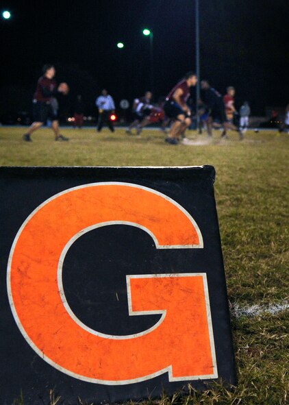 The 23rd Medical Group attempts to make a play after a touchdown was made by the 23rd and 347th Operation Support Squadrons during an intramural flag football championship game at Moody Air Force Base, Ga., Nov. 10, 2011. The 23rd MDG and the 23rd and 347th OSS teams met during last year’s championship game with the 23rd MDG coming out on top. (U.S. Air Force photo by Airman 1st Class Olivia Dominique/Released)