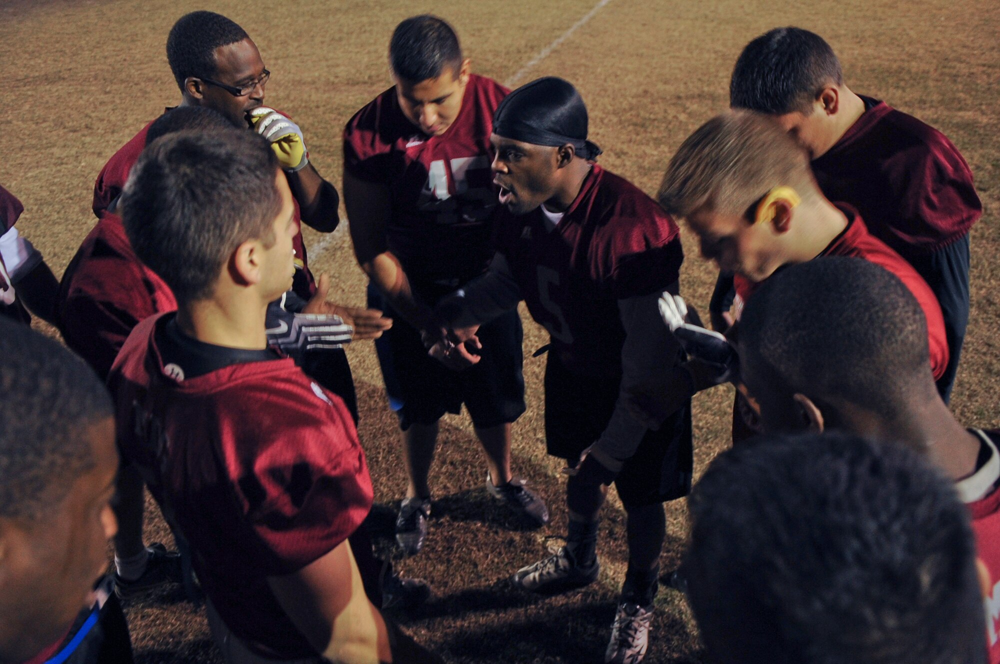 Darius Perry, 23rd Medical Group coach, encourages the team after a rough first half to an intramural flag football champion game at Moody Air Force Base, Ga., Nov. 10, 2011. The 23rd MDG played in the annual Moody flag football championship game against the 23rd and 347th Operation Support Squadrons. (U.S. Air Force photo by Airman 1st Class Olivia Dominique/Released)