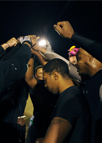 The 23rd and 347th Operation Support Squadron flag football team celebrates after beating the 23rd Medical Group and earning the title of Moody Air Force Base 2011 intramural flag football champions, Nov. 10, 2011. The team, who also played the 23rd MDG in last year’s championship game, sought revenge by winning their first flag football title with a score of 12-3. (U.S. Air Force photo by Airman 1st Class Olivia Dominique/Released)