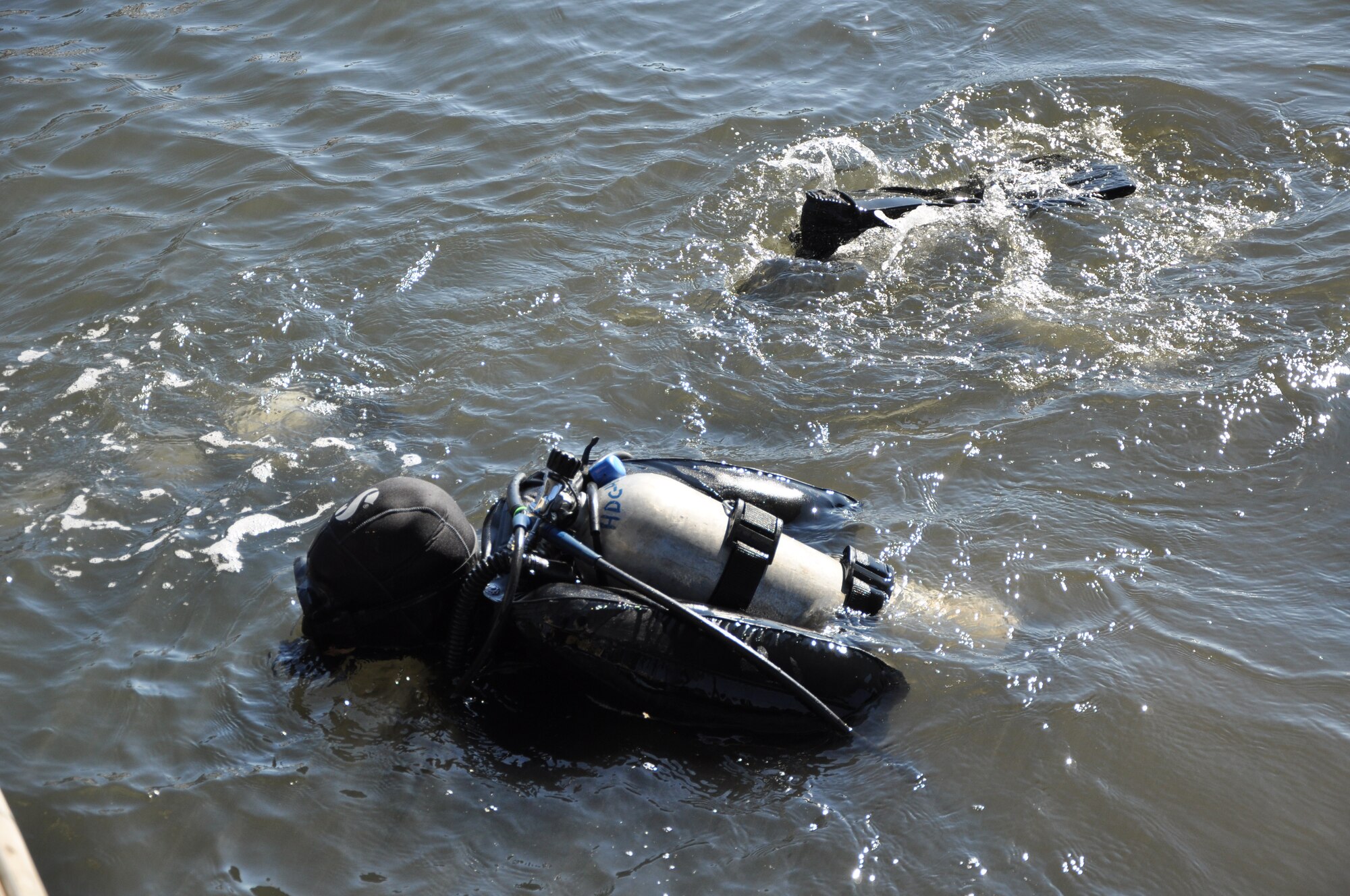 Students from Air Force Special Operations Command Special Tactics Training Squadron, Hurlburt Field, Fla., participate in a cleanup of the Hurlburt Marina Nov. 12, 2011. Volunteers cleared the waterways of 3,700 pounds of debris.(U.S. Air Force photo/Rachel Arroyo) RELEASED