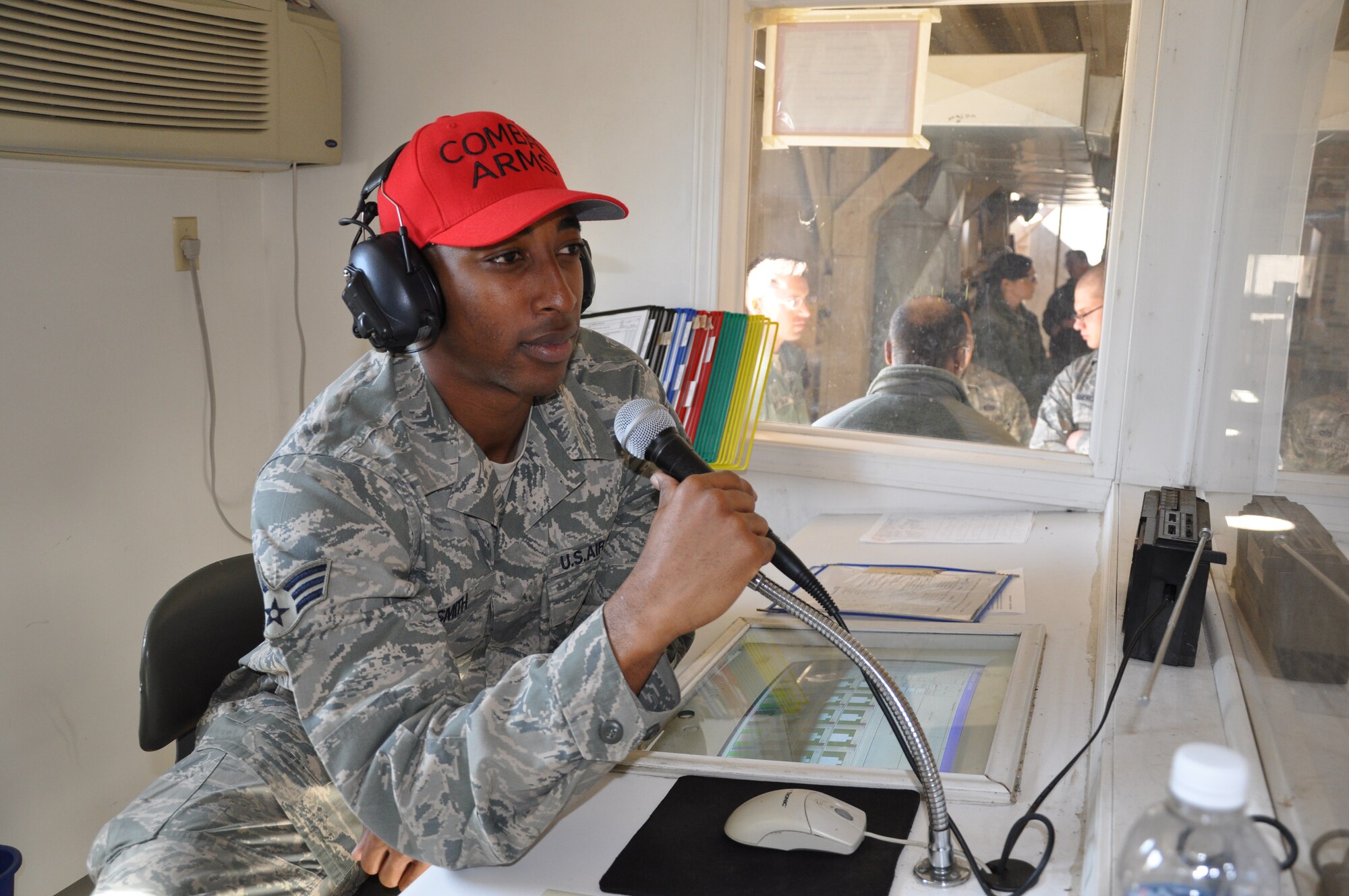 Senior Airman Bronsha Smith, a CATM instructor for the 931st Security Forces Squadron, issues orders on the firing line during weapons training at the CATM, here. Smith is in his sixth week of training at the Wichita Law Enforcement Trainng Center, preparing to become a Wichita police officer. (Air Force photo by 1st Lt. Zach Anderson)