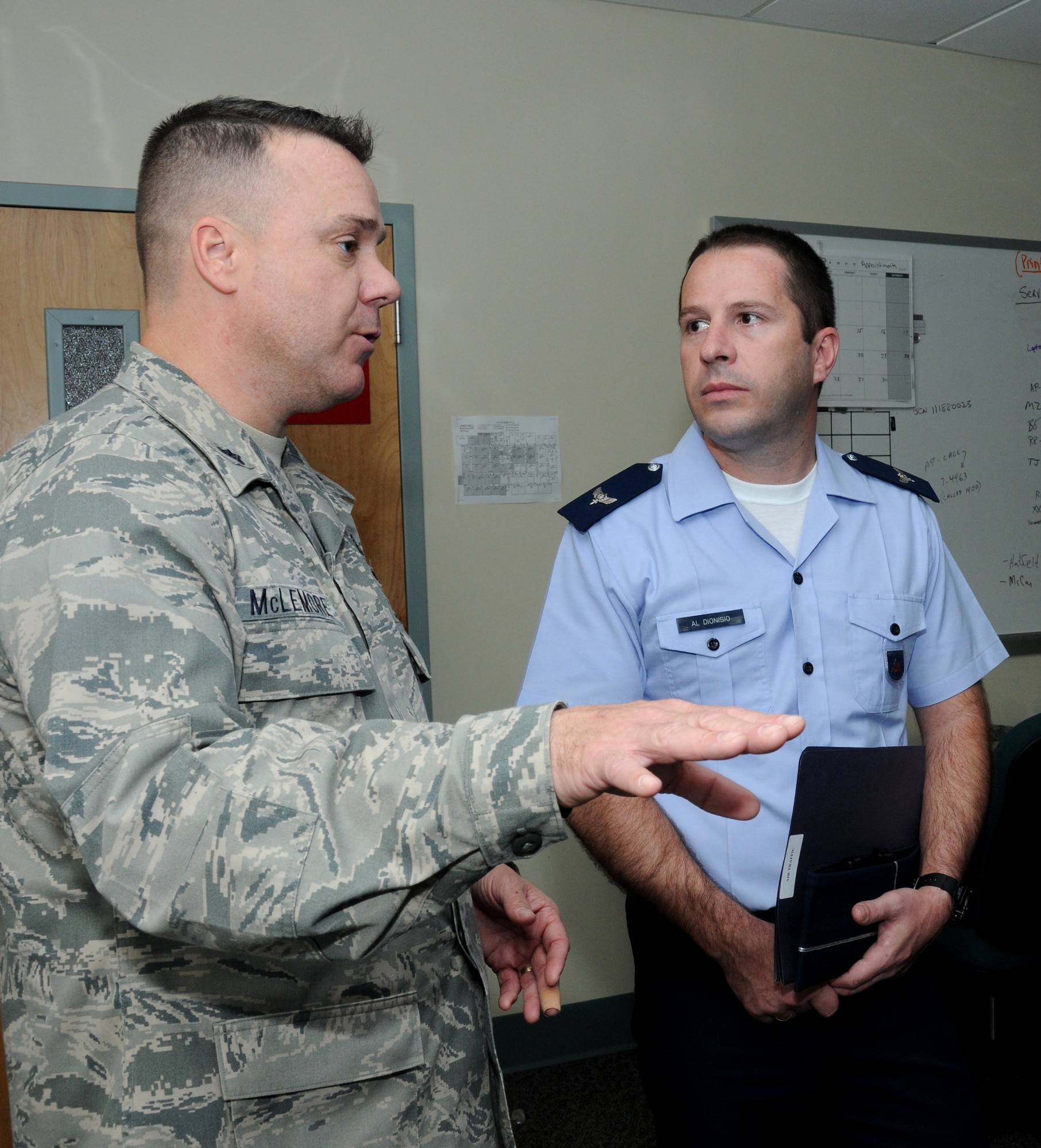Lt. Col. Jeffrey McLemore, 334th Training Squadron commander briefs officer student Dionisio Moreira, Brazilian Air Force, during a tour of the air traffic control school at Cody Hall, Keesler Air Force, Base, Miss., Nov. 16, 2011.  Members of the Brazilian Air Force also toured base operations and ate lunch at Bay Breeze Event Center.  Brig. Gen. Andrew Mueller, 81st Training Wing commander, noted Keesler’s cooperation with the Brazilian military over the past 67 years.  Brazilian soldiers completed aircraft mechanics courses At Keesler beginning in 1944.  (U.S. Air Force photo by Kemberly Groue)