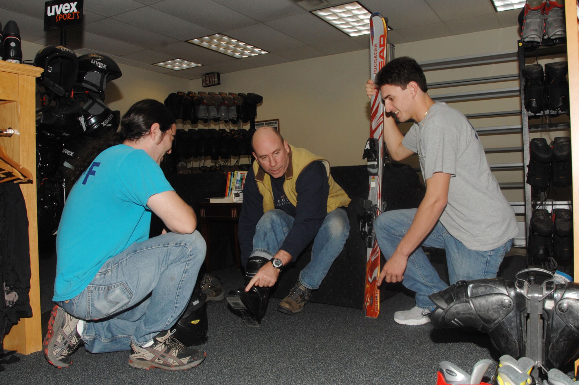 HANSCOM AIR FORCE BASE, Mass. – Outdoor Recreation employees Brad Lavoie (left) and Michael Barbacano (right) assist Tim Burr with a ski fitting Nov. 8. Just in time for winter weather, Outdoor Recreation is offering ski and snowboard tuning services, preseason fitting specials and seasonal ski rentals. (U.S. Air Force photo by Linda LaBonte Britt)