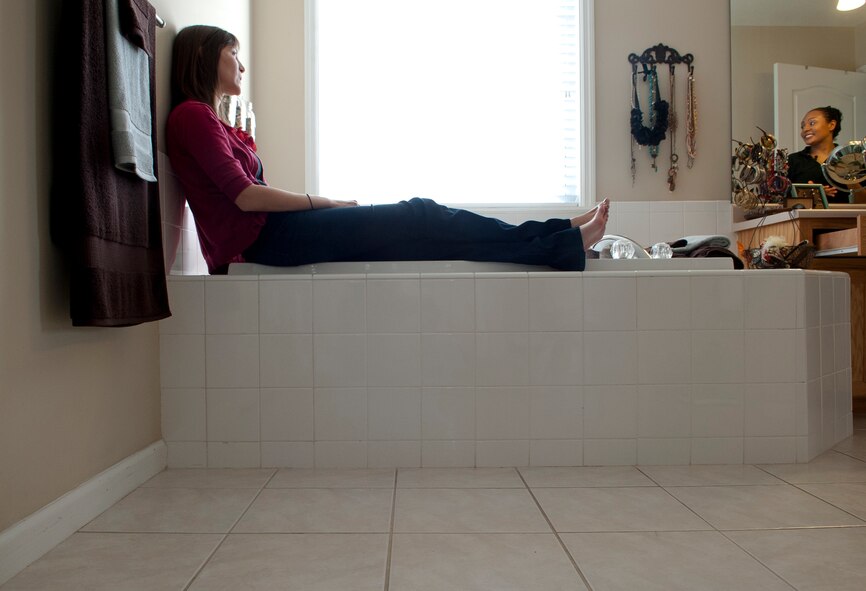 Kristen McSpadden, spouse of U.S. Air Force Capt. Cecil McSpadden, 822nd Base Defense Squadron officer in charge of intelligence, and 2nd Lt. Cara Bousie, 23rd Wing deputy chief of Public Affairs, exchange stories of how their husbands proposed to them Nov. 12, 2011, in Valdosta, Ga. Although McSpadden is a civilian and Bousie is an Air Force officer, both went through the same feelings and emotional rollercoaster while separated from their husbands. Their friendship made it easy to confide in one another. (U.S. Air Force photo by Airman 1st Class Joshua Green/Released)                   
          
           
        
