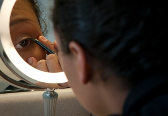 U.S. Air Force 2nd Lt. Cara Bousie, 23rd Wing deputy chief of Public Affairs, applies eye liner while preparing herself for her husband’s return in Valdosta, Ga., Nov. 12, 2011. Bousie was separated from her husband for six months while he and his unit provided air base defense in Iraq supporting Operation New Dawn. (U.S. Air Force photo by Airman 1st Class Joshua Green/Released)                
           
        
