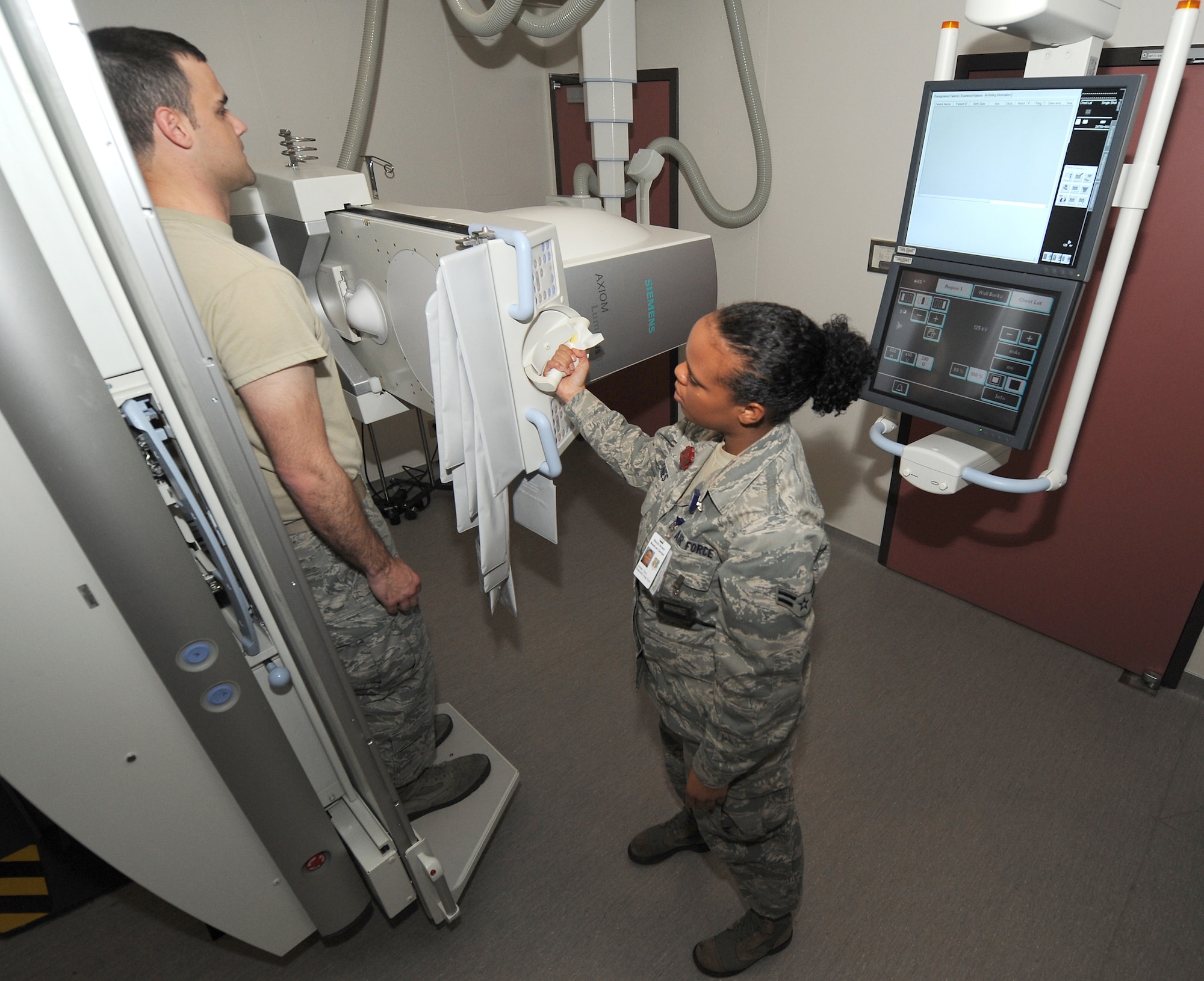 Airman 1st Class Tara Jones, diagnostic imaging technologist, demonstrates fluoroscopy Nov. 9 at the David Grant USAF Medical Center. Fluoroscopy is an imaging technique commonly used by physicians to obtain real-time moving images of the internal structures of a patient through the use of a fluoroscope. (U.S. Air Force photo/Staff Sgt. Liliana Moreno)