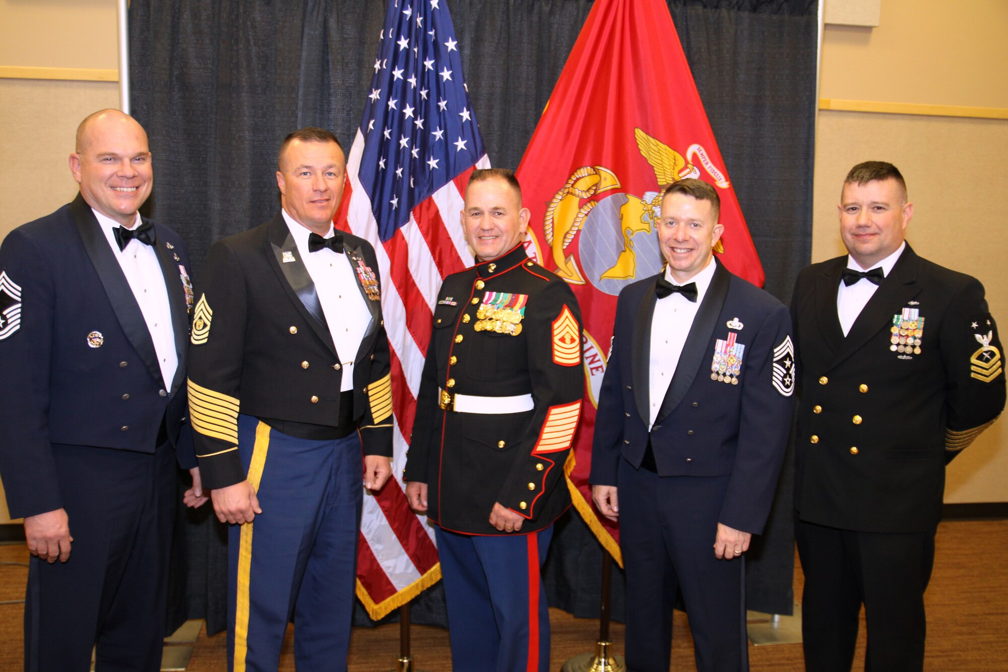 SAN ANGELO, Texas -- (From left:) Chief Master Sgt. Andrew Barth, 312th Training Squadron Superintendent; Army Command Sgt. Maj. Dan McCraw, 344th Military Intelligence Battalion; Marine Corps Master Gunnery Sgt. Peter Bordeleau, Marine Corps Detachment; Chief Master Sgt. Brendan Criswell, 17th Training Wing Command Chief; and Navy Master Chief Petty Officer Shannon Day, Navy Center for Information Dominance, attend the Marine Corps Ball, Nov. 10, marking the Service's 236th birthday. (Courtesy photo/Army Staff Sgt. Michael Carlson)