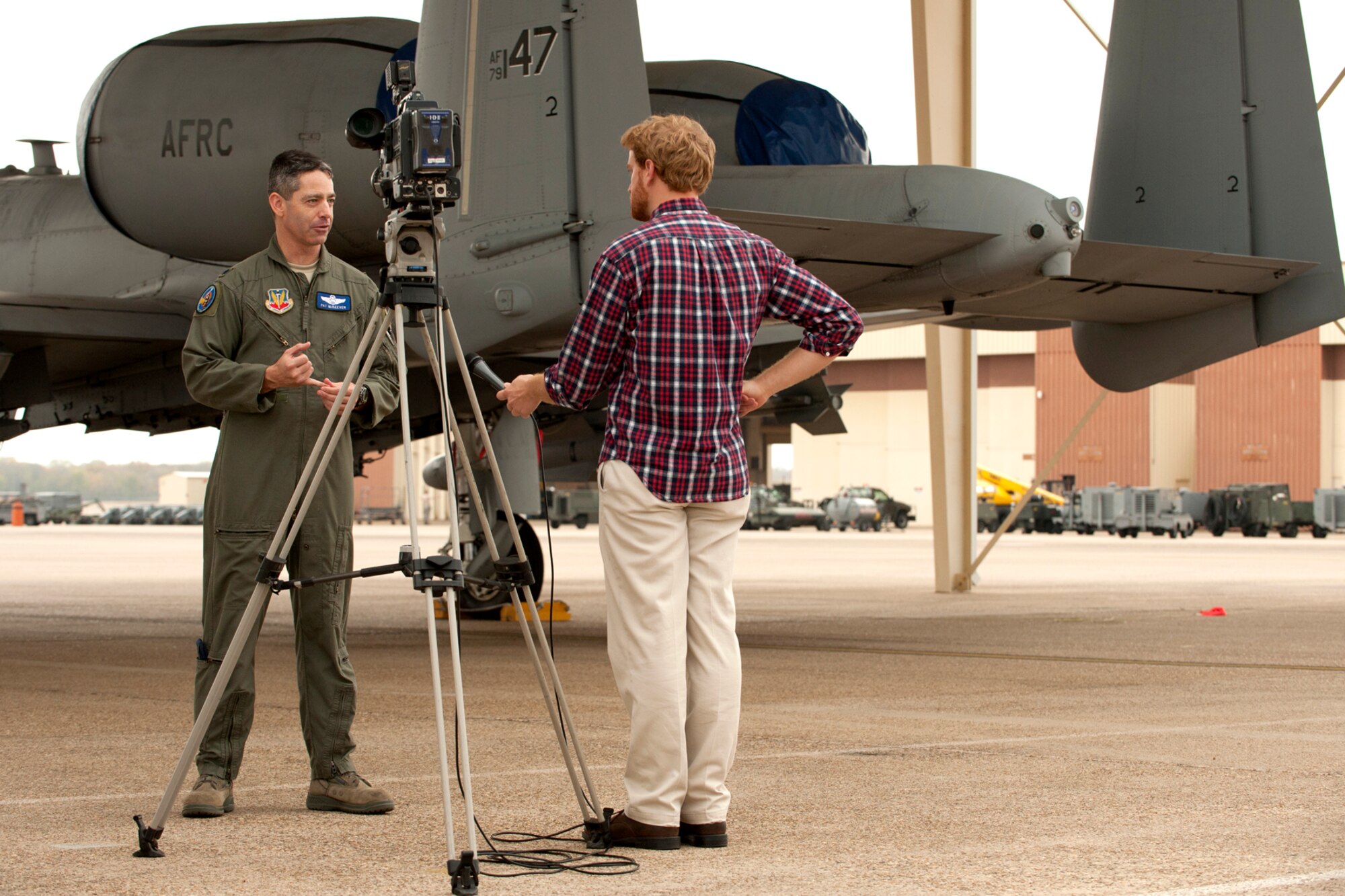 U.S. Air Force Lt. Col. Patrick McKeever, 548th Combat Training Squadron (CTS)/Detachment 1 commander, is interviewed by Paul Sweazy, KTBS Channel 6 photo journalist, during a Barksdale Profile segment, Barksdale Air Force Base, La., Nov. 15, 2011. The 548th CTS, along with its detachment at Barksdale, executes Green Flag East exercises, providing operational control, safe employment, and realistic close-air-support training for tactical aircrews and tactical air control parties at the U.S. Army Joint Readiness Training Center, Fort Polk, La. (U.S. Air Force photo by Master Sgt. Greg Steele/Released)