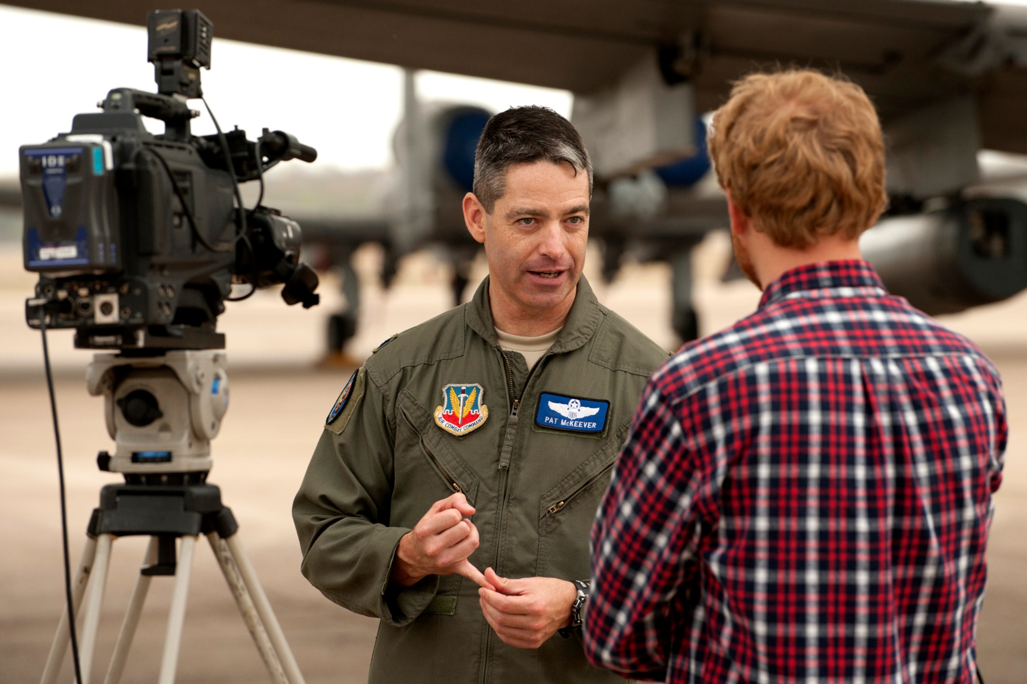 U.S. Air Force Lt. Col. Patrick McKeever, 548th Combat Training Squadron (CTS)/Detachment 1 commander, is interviewed by Paul Sweazy, KTBS Channel 6 photo journalist, during a Barksdale Profile segment, Barksdale Air Force Base, La., Nov. 15, 2011. The 548th CTS, along with its detachment at Barksdale, executes Green Flag East exercises, providing operational control, safe employment, and realistic close-air-support training for tactical aircrews and tactical air control parties at the U.S. Army Joint Readiness Training Center, Fort Polk, La. (U.S. Air Force photo by Master Sgt. Greg Steele/Released)