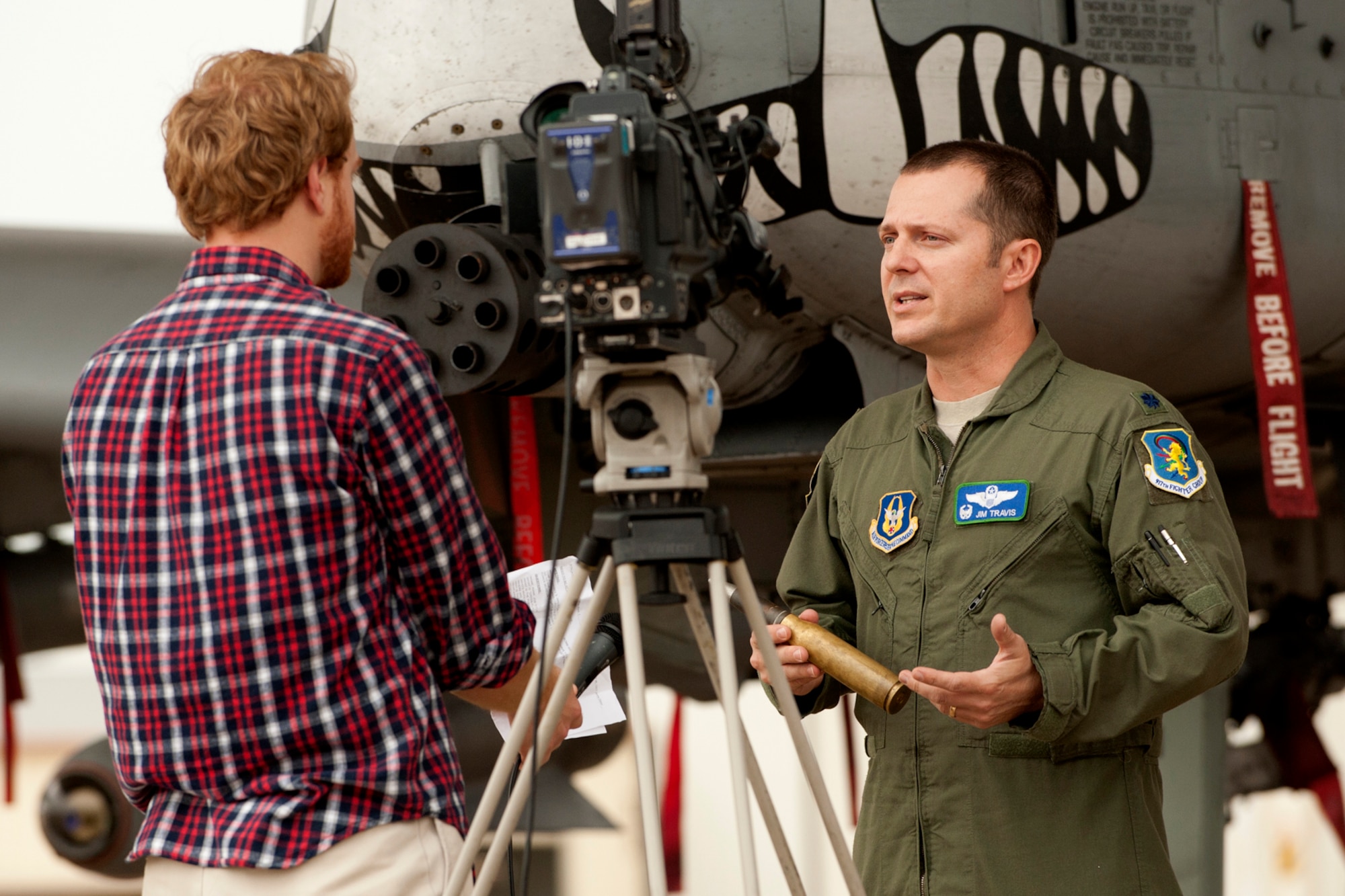 Paul Sweazy, KTAL Channel 6 photojournalist, interviews Lt. Col. James Travis, 47th Fighter Squadron (FS) commander, for a Barksdale Profile segment on the Green Flag exercise at Barksdale Air Force Base, La., Nov. 15, 2011. The 47th FS flies the A-10 Thunderbolt II and is participating in the exercise, which provides realistic close-air-support training for tactical aircrews and tactical air control parties at the U.S. Army Joint Readiness Training Center at Fort Polk, La. (U.S. Air Force photo by Master Sgt. Greg Steele/Released)
