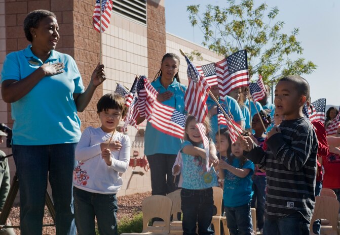 Children line up for the Pledge of Allegiance  during the grand opening ceremony of the Child Development Center I Nov. 14, 2011, on Nellis Air Force Base, Nev. More than 90 people were in attendance for the ceremony.(U.S Air Force photo by Senior Airman Stephanie Rubi / Released)