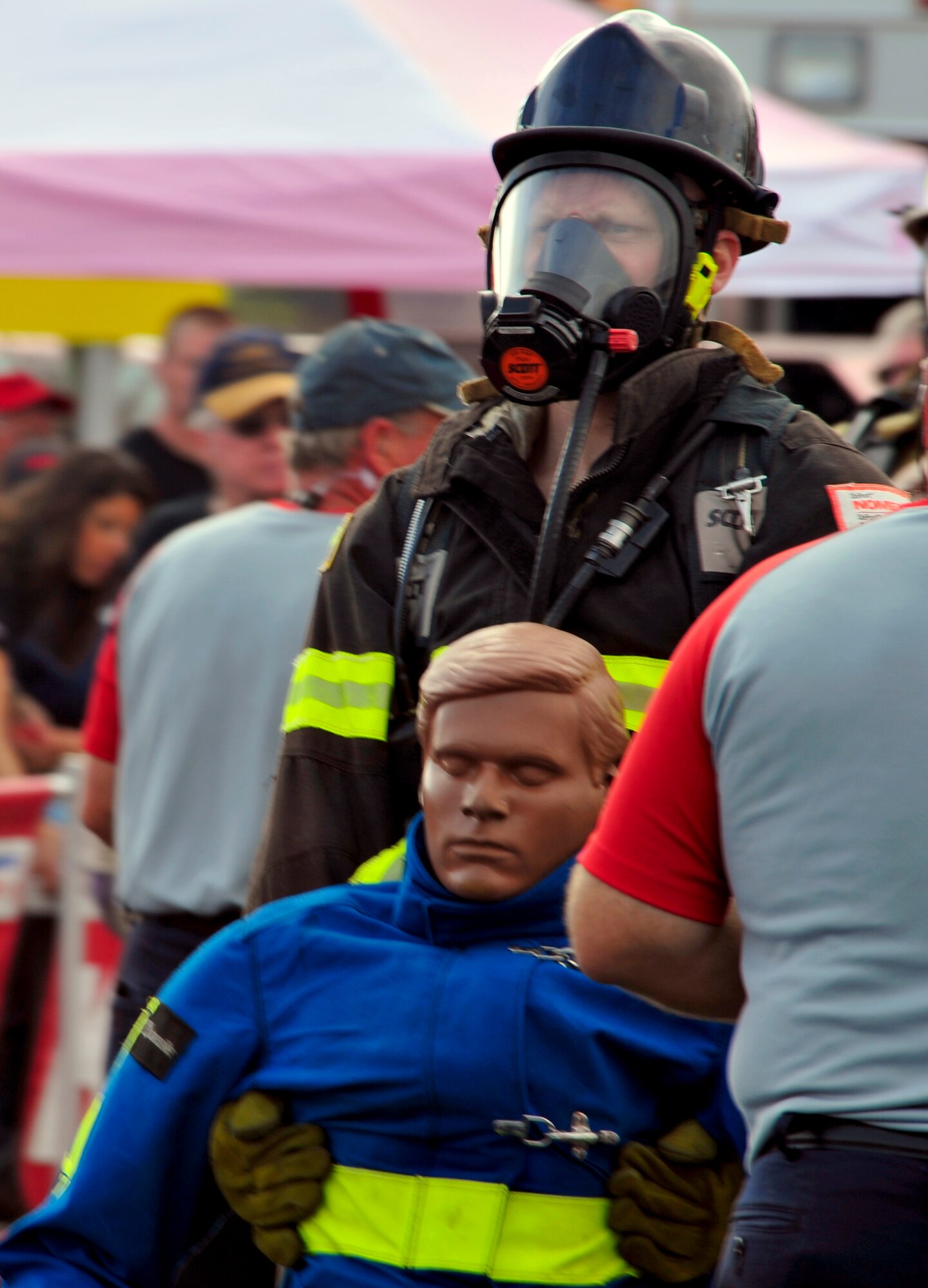 Staff Sgt. Chastin Warner, 20th Civil Engineer Squadron firefighter, drags the 175-pound rescue dummy down the final stretch of his race at the Scott Firefighter Combat Challenge world competition ate Myrtle Beach, S.C. Nov. 15, 2011. Warner's individual race time inducted him into the Lion's Den, a group for the elite compeititors, making him one of the top firefighters in this competition in the world. (U.S. Air Force photo/Airman 1st Class Daniel Phelps/Released)