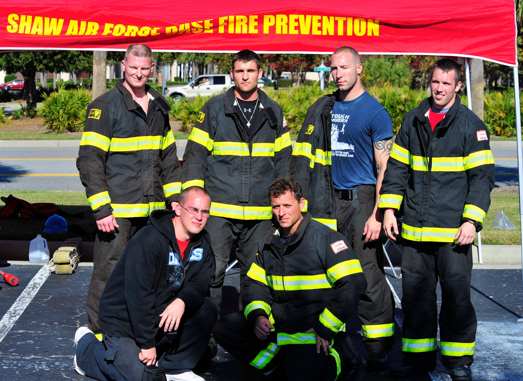 The 20th Civil Engineer Squadron firefighter competition team,(from top left) Tech. Sgt. Marcus Hewett, Airman 1st Class Robert Dentici, Staff Sgt. Chastin Warner, Staff Sgt. Steven Thomas, (from bottom left) Staff Sgt.Jesse Tompson and Tech. Sgt. Travis Mills pose in front of their tent at the Scott Firefighter Combat Challenge world competition at Myrtle Beach, S.C., Nov. 11, 2011. Last year the the Shaw firefighters placed in the top 10 percent in the world at this competition. (U.S. Air Force photo/Airman 1st Class Daniel Phelps/Released) 