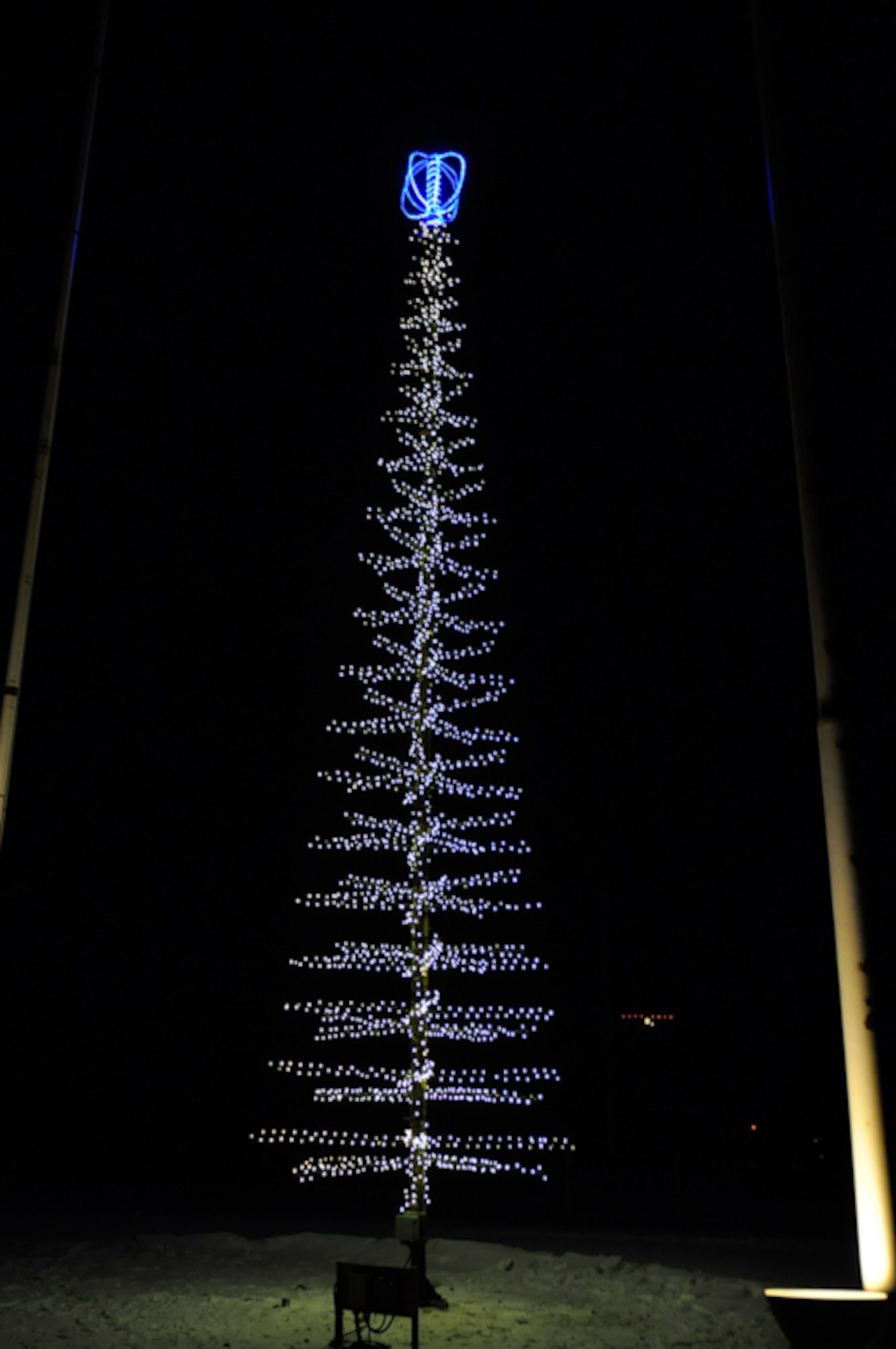 THULE AIR BASE, Greenland -- The 821st Air Base Group held its holiday tree lighting Nov. 11 in front of the headquarters building. The event roughly coincides with the beginning of the dark season at Thule; the base won’t see sunshine again until February. Thule Air Base, located about 750 miles north of the Arctic Circle, is one of six installations operated by the 21st Space Wing. (U.S. Air Force photo/Senior Airman Zhenhua Xie)