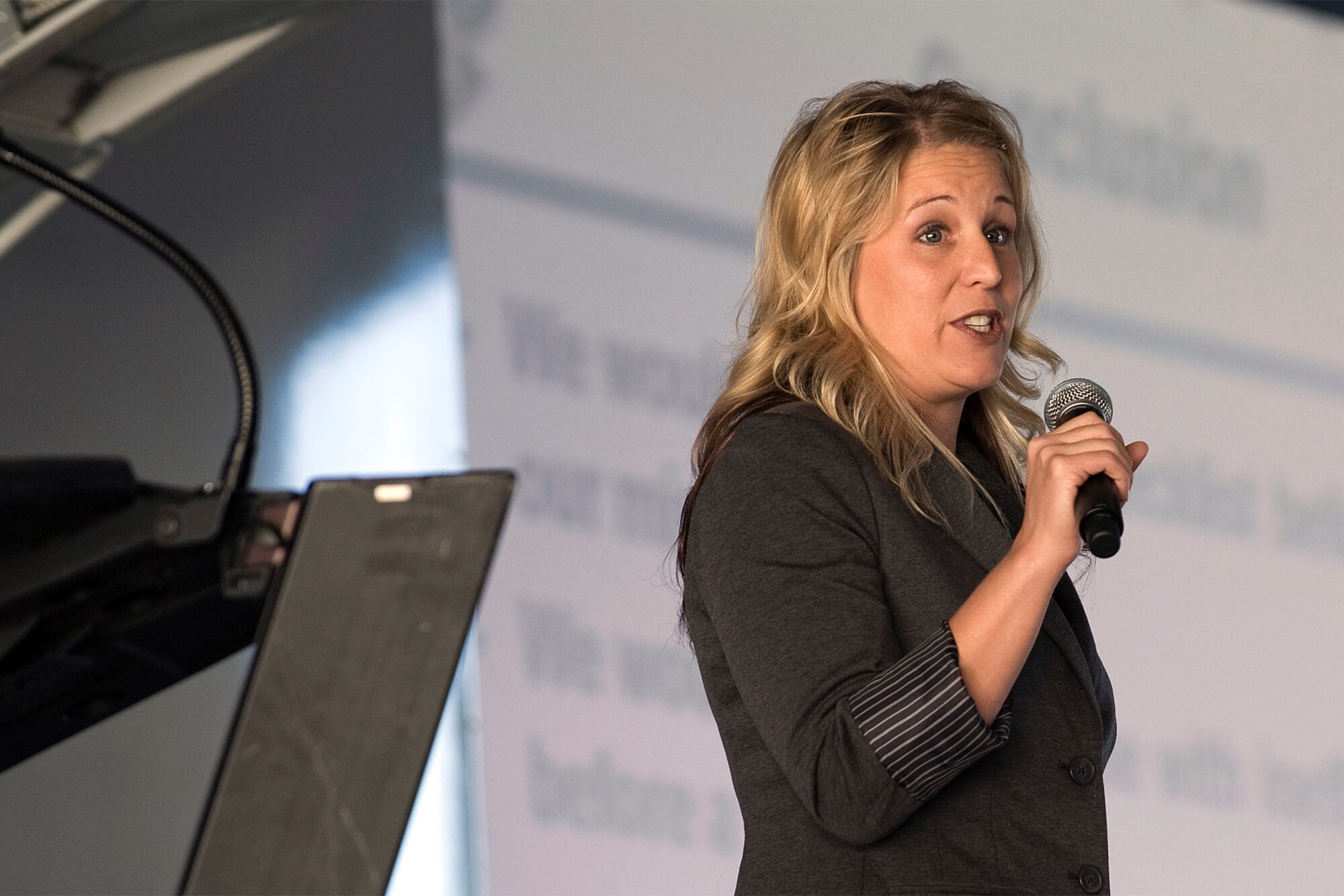 Jennifer Crowley from the Peterson Health and Wellness Center, talks about good nutrition choices during Wingman Day Nov. 10 at hangar 140. Nutrition is part of the physical fitness element of the Air Force’s Comprehensive Airman Fitness campaign. (U.S. Air Force photo/Craig Denton)