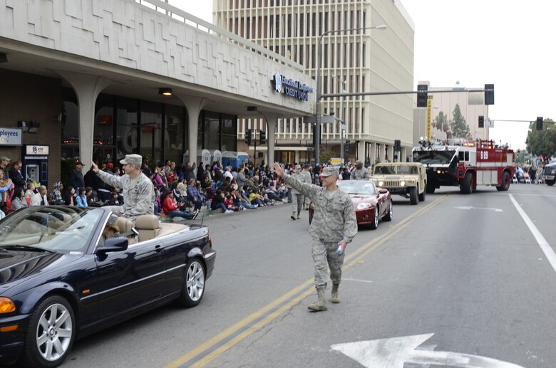 U.S. Air Force Colonel Sami Said, 144th Fighter Wing Commander, California Air National Guard, waves to the spectators as he walks in the 92nd Annual Fresno Veterans Day Parade.  The parade is considered the largest event of its kind west of the Mississippi with over 9,000 participants and volunteers.  (U.S. Air Force photo SMSgt Chris Drudge)