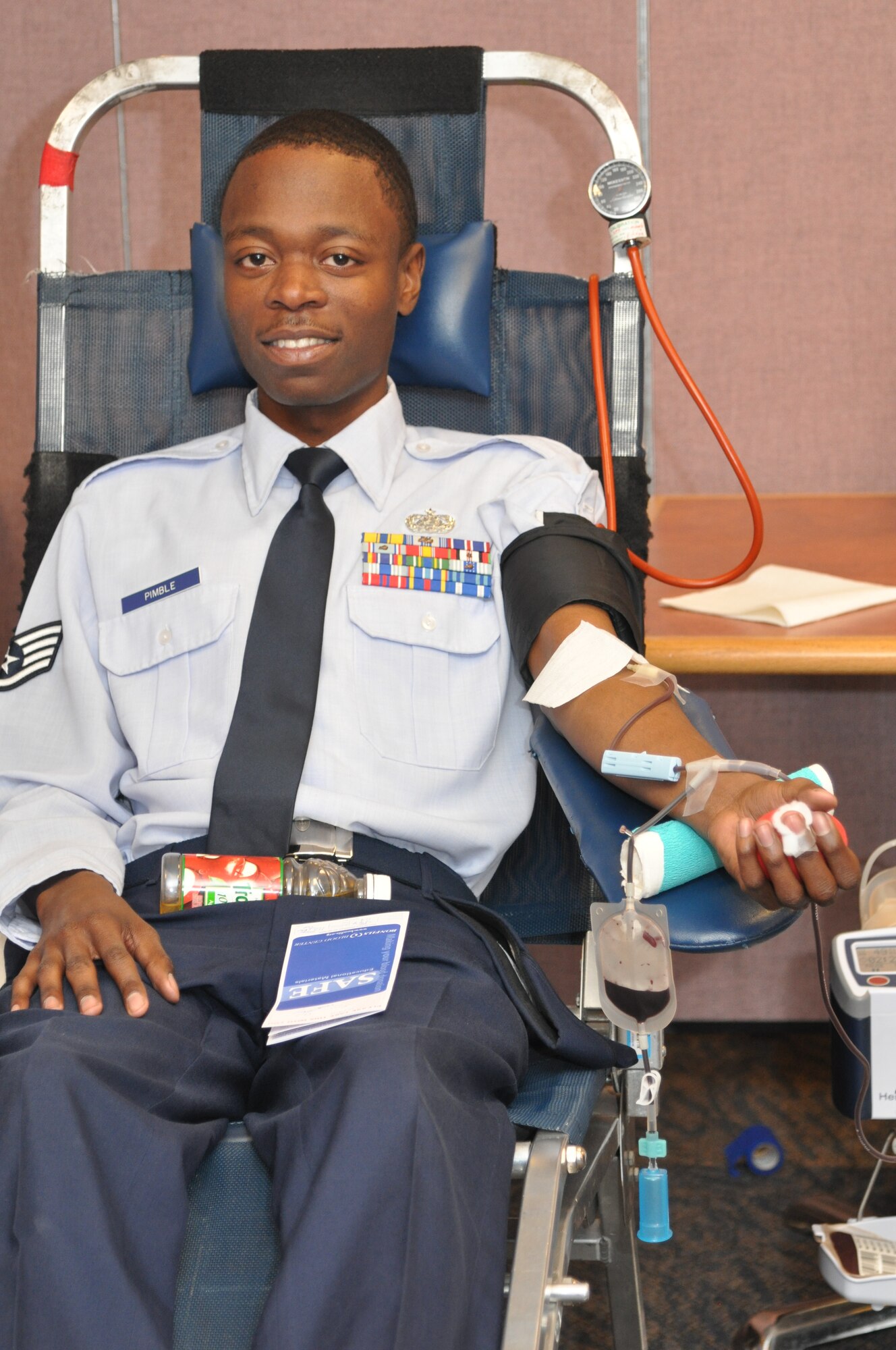 BUCKLEY AIR FORCE BASE, Colo. - Staff Sgt. Allen Pimble, 460th Space Wing Cyber Systems Operation technician, donates blood at Buckley Air Force Base Blood Drive Nov. 16 2011.The purpose of this event was to raise awareness about the need for blood donors.