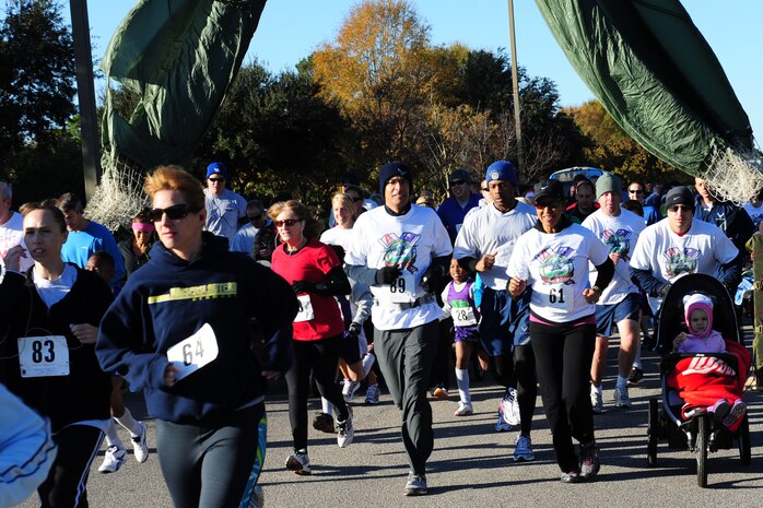 Team Charleston personnel and local civilians pace themselves at the start of the third annual Run the Runway 5K event honoring Brig. Gen.  Thomas Mikolajcik Nov. 11 at Joint Base Charleston - Air Base. The 5k course took place on JB Charleston's runway.  The event was held to raise awareness of Amyotrophic Lateral Sclerosis.  (U.S. Air Force photo/Tech. Sgt. Chrissy Best) 


