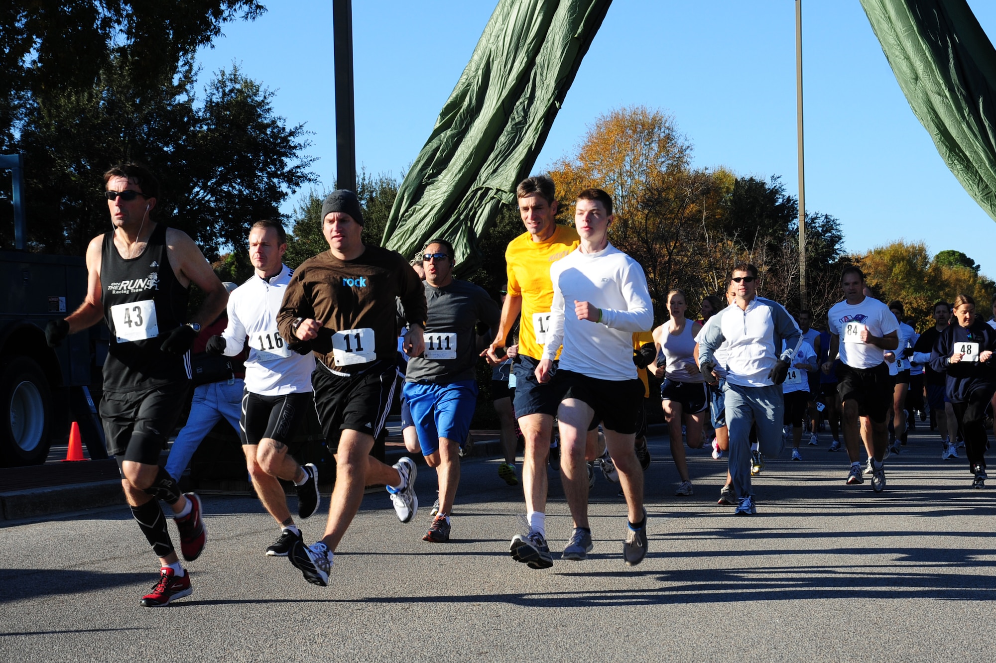 Team Charleston personnel and local civilians pace themselves at the start of the third annual Run the Runway 5K event honoring Brig. Gen. Thomas Mikolajcik Nov. 11 at Joint Base Charleston - Air Base. The 5k course took place on JB Charleston's runway.  The event was held to raise awareness of Amyotrophic Lateral Sclerosis.  (U.S. Air Force photo/Tech. Sgt. Chrissy Best) 

